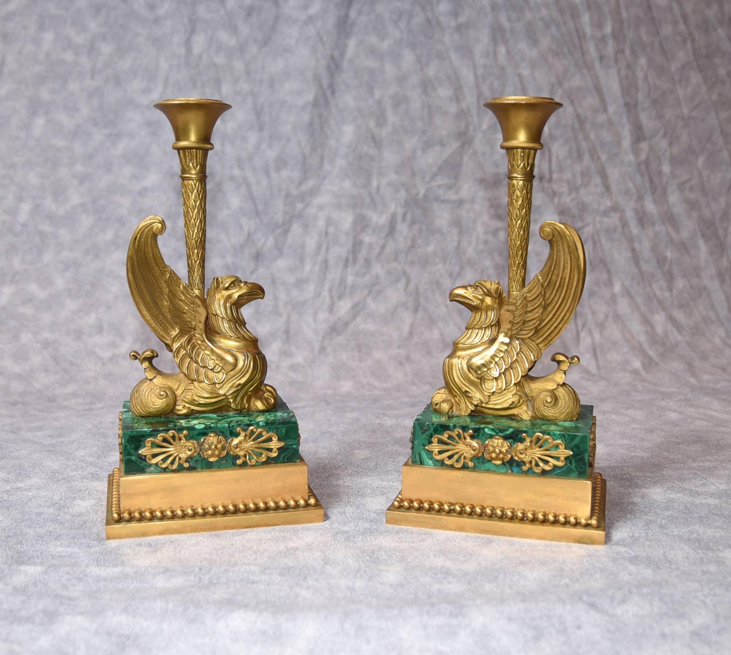 Outstanding pair of antique French Empire bronze griffin candlesticks
Of exceptional quality this pair are adorned with malachite to the base
Hopefully the photos illustrate the quality to the casting, very intricate
Griffins look great with