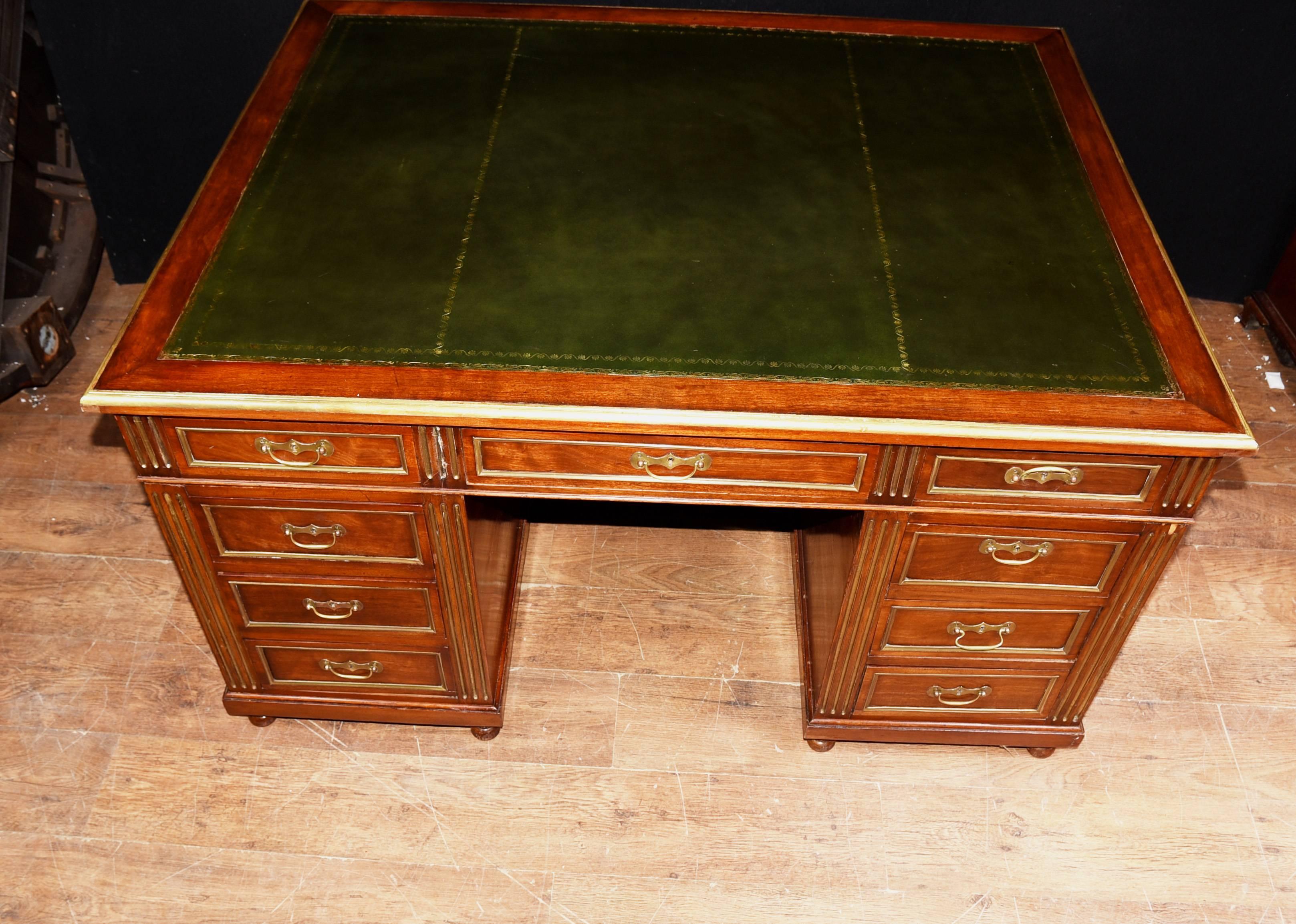Gorgeous antique French Napoleon III desk in mahogany with brass channelling and fixtures
Great looking piece with lots of writing surface, great for a home office set up
Top has a green leather writing surface
Lots of storage with all the