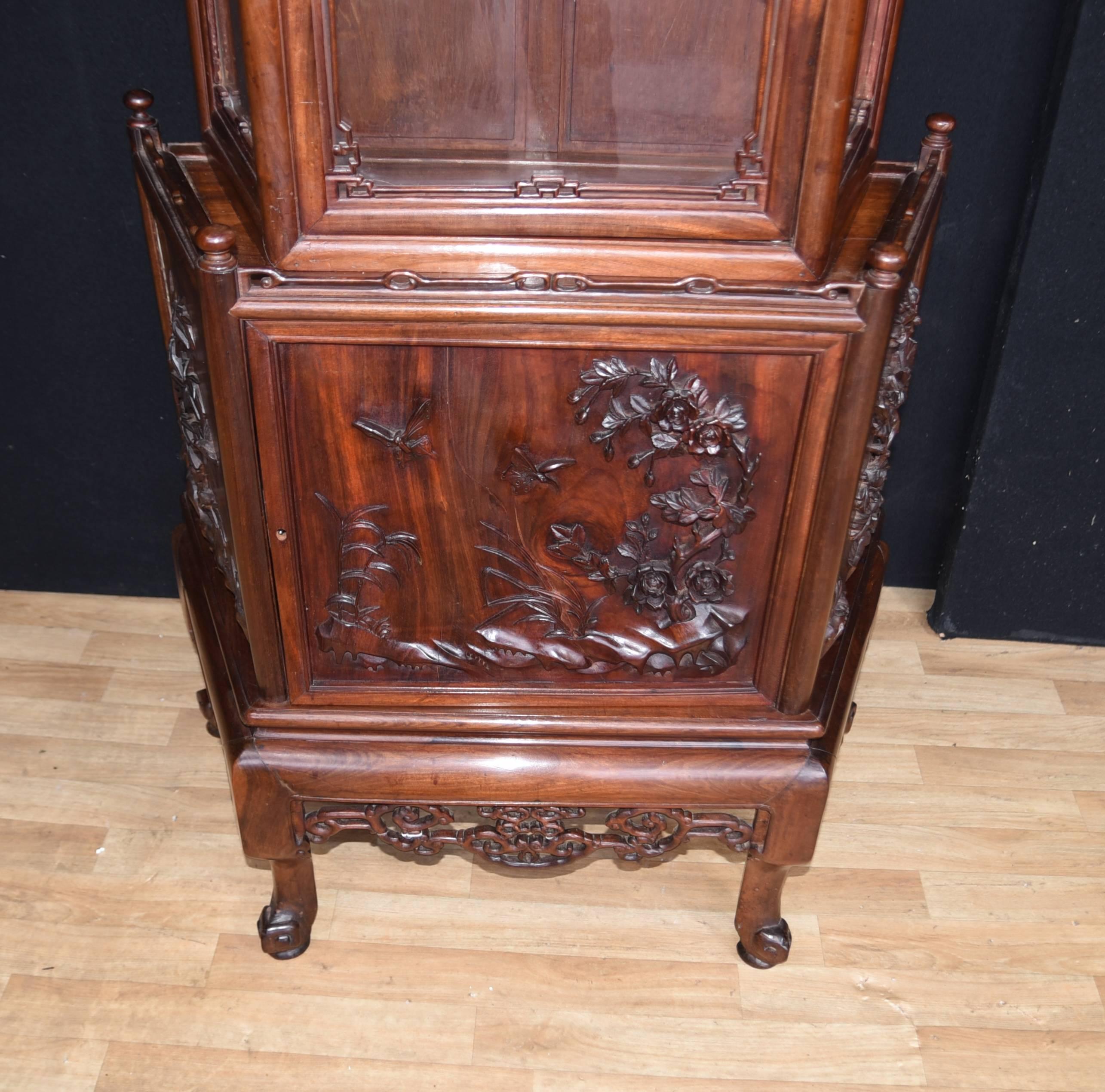 Gorgeous antique Chinese Padauk hardwood display cabinet
Unusual work, our attention was initially drawn to the fact that the carving is deep relief from the solid wood and not applied
Great as a display cabinet or bookcase
Carved details are