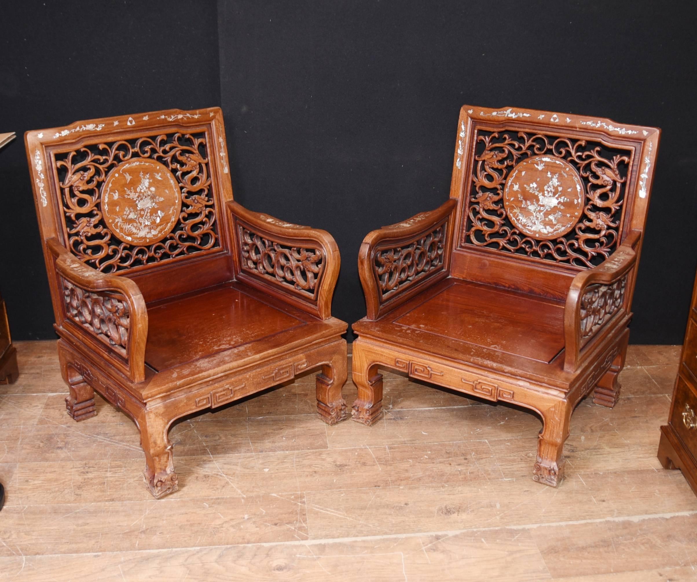 Gorgeous pair of Chinese hardwood antique arm chairs 
Feature intricate mother-of-pearl inlay to back and arms, very detailed
Intricately carved details very well executed
Great interiors pair, would look good with the right sort of cushion
We