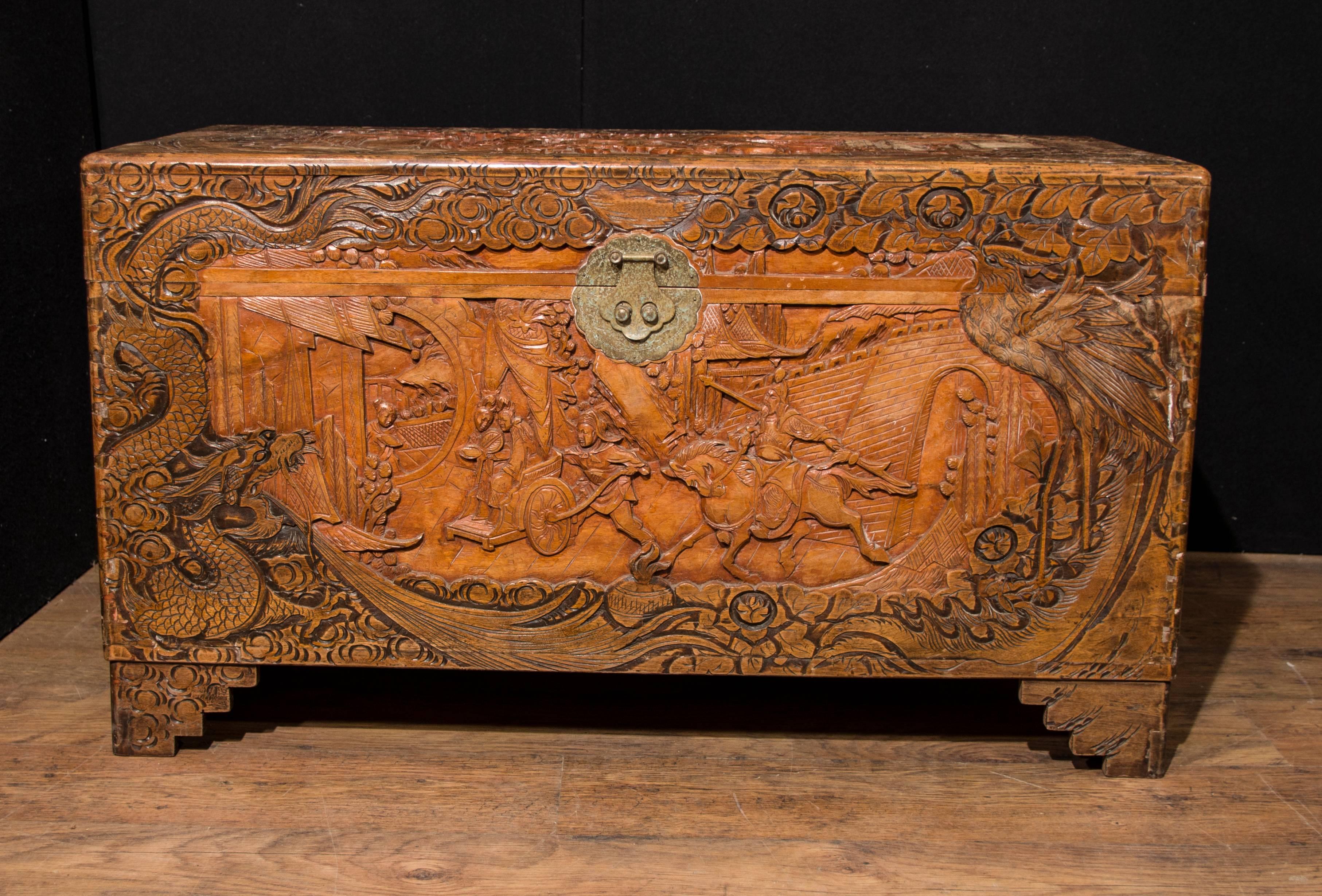Gorgeous antique Chinese camphor wood trunk or luggage chest
Very intricately hand-carved with a profussion of details
In the 18th and 19th centuries, camphor chests were used to carry tea, silks and porcelain from China to European destinations,