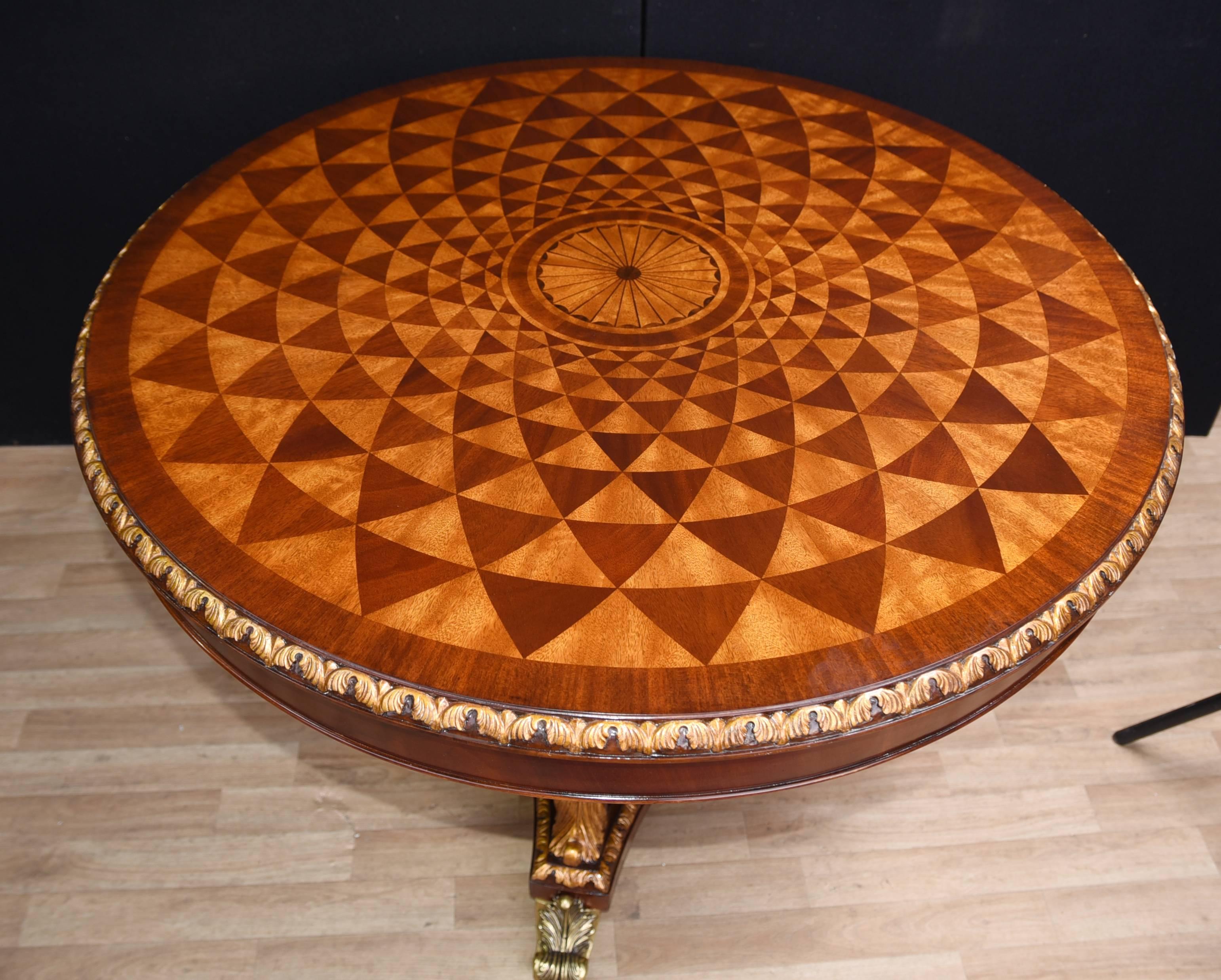 You are viewing an incredible Regency style centre table with an intricate spyrogaph design made from inlays of various woods including, fruitwood, mahogany, walnut, oak all imbedded into the mahogany. 

The levels of craftmanship that goes into