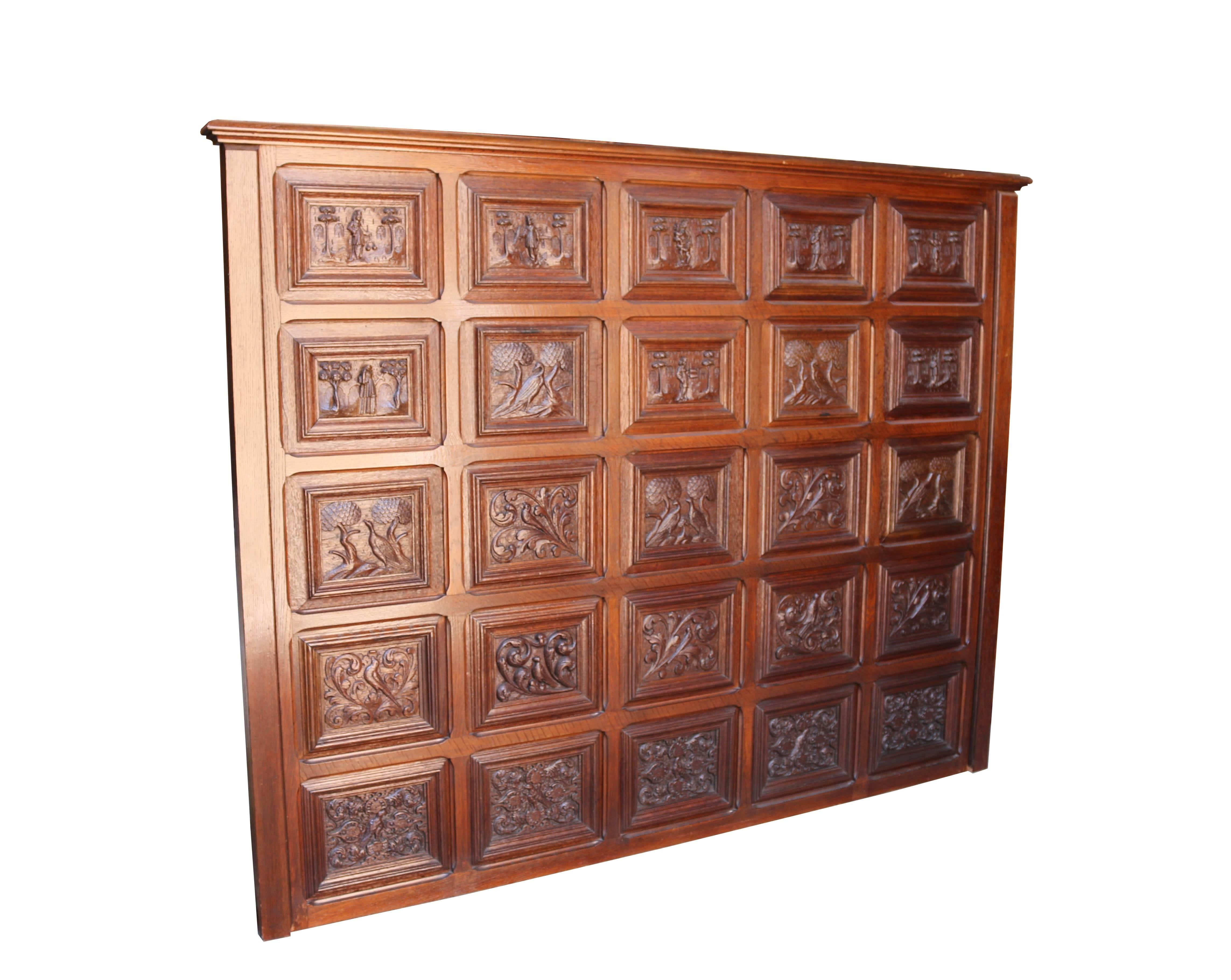 Consisting of 25 hand-carved oak panels set within an oak frame. Believed to have been purpose made as a headboard. The back previously having been covered with material.
