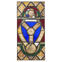 Vitrail du XIXe siècle représentant le blason de la Trinité