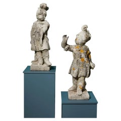 Pair of Weathered Stone Statues of Cherubs in Military Dress