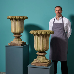 Pair of Weathered Composition Stone Tulip Urns