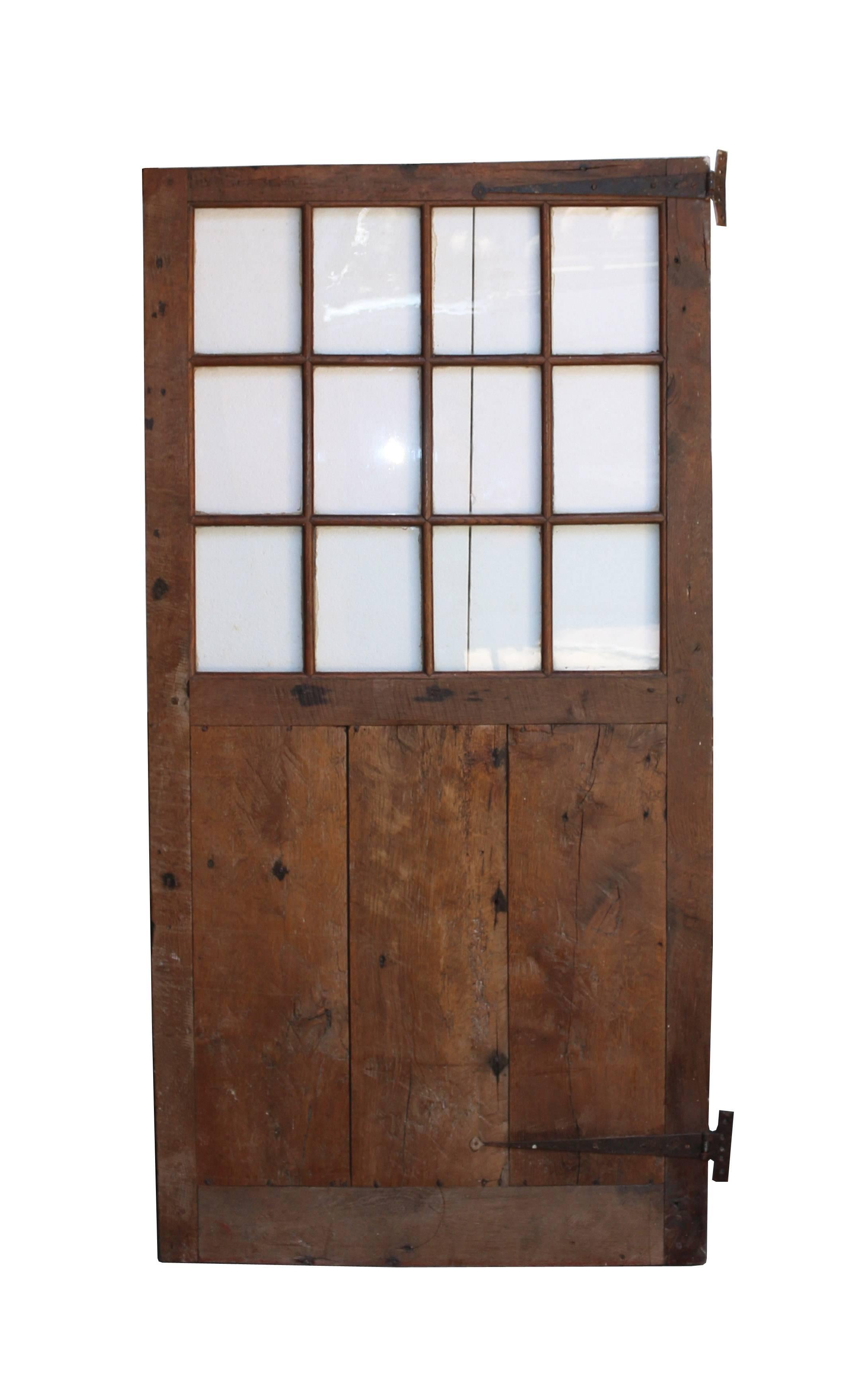 Late 18th century English glazed oak door. Not for external use.
(Please note that the glass is not insured in transit outside of the UK).