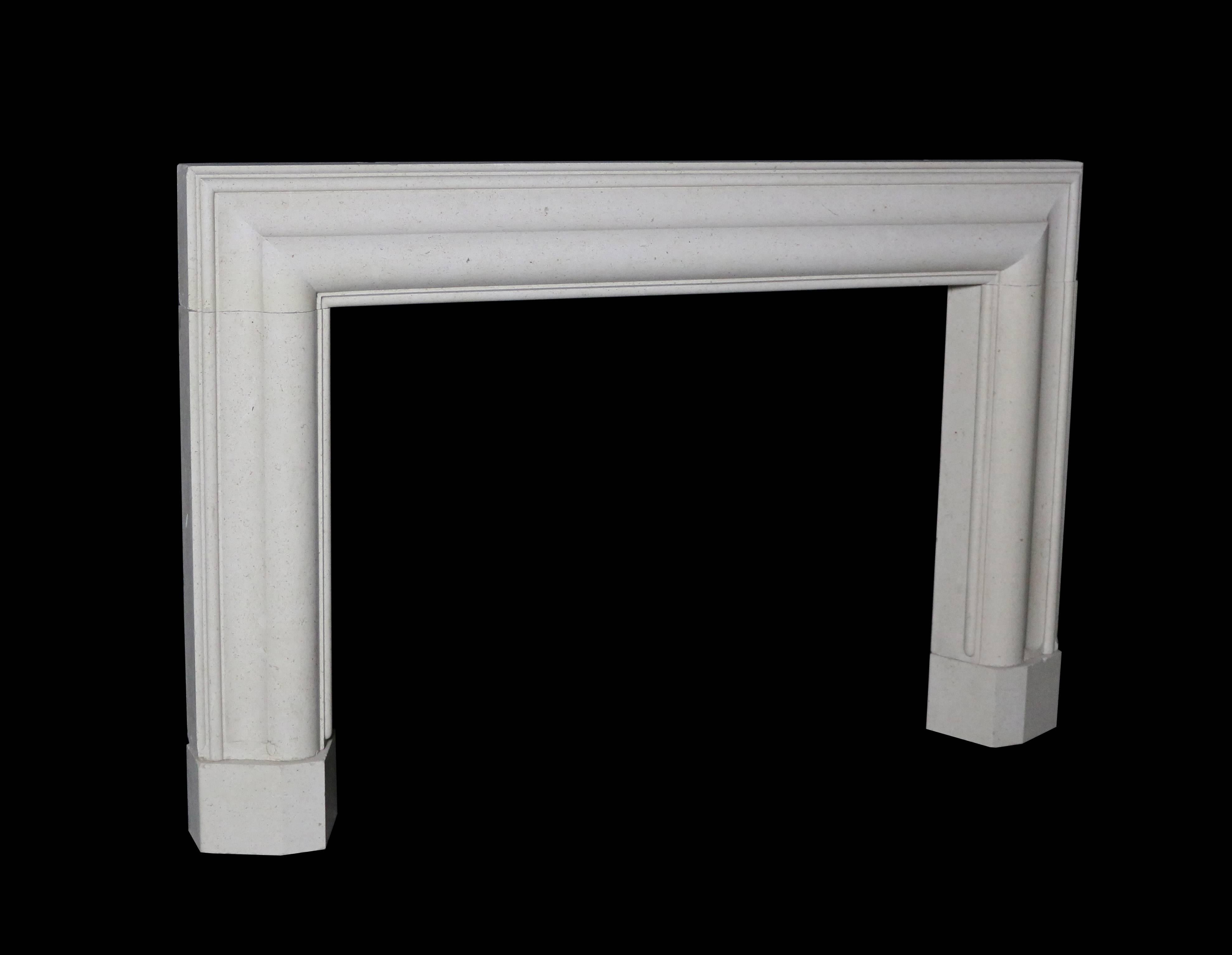 1920s Art Deco polished limestone bolection fire surround. Opening H 87 x W 117 cm.