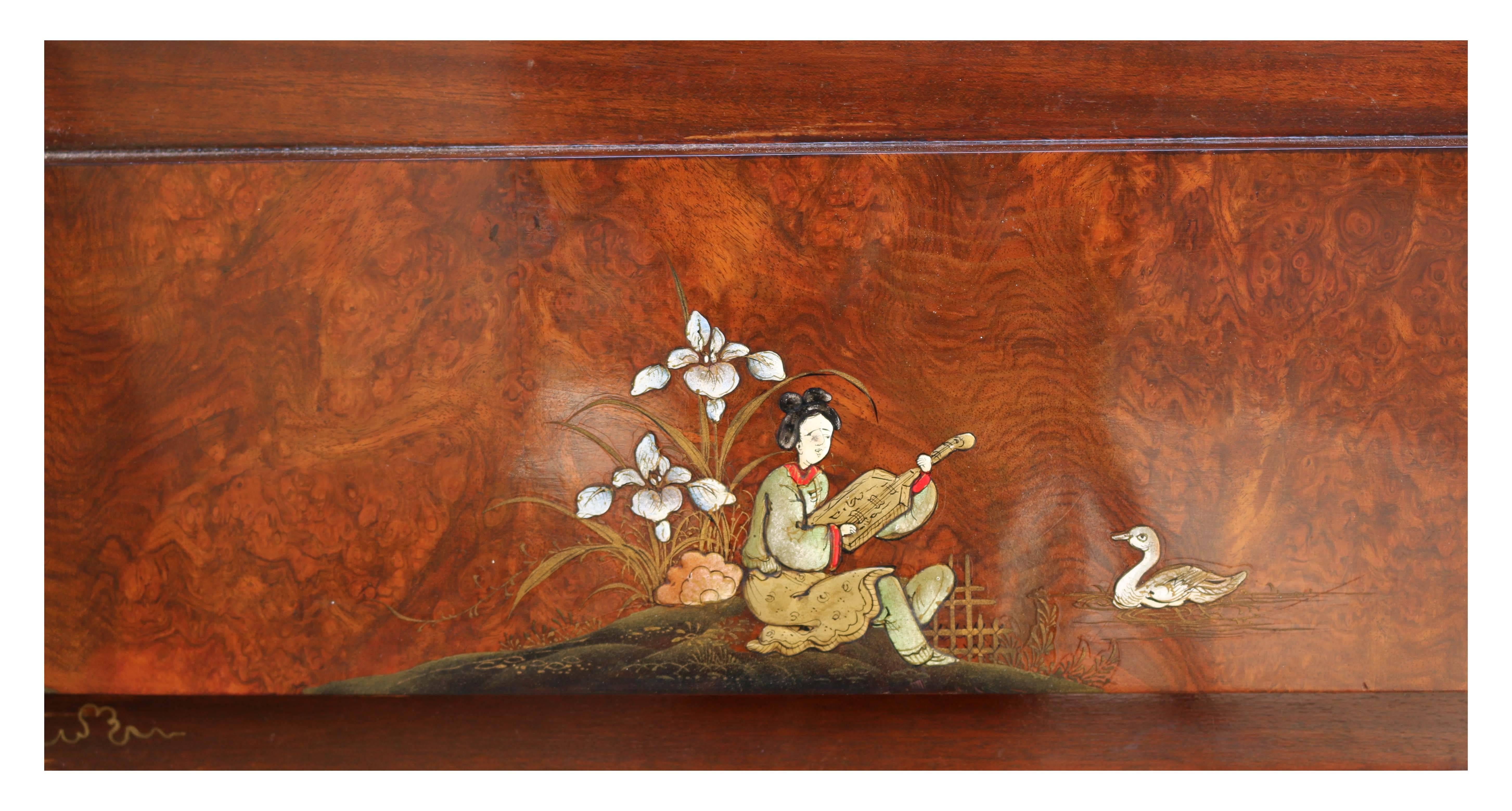 Burr walnut veneer with hand-painted decoration depicting Japanese scenes.

Opening H 84 x W 121 cm (33 x 47.5 inches).