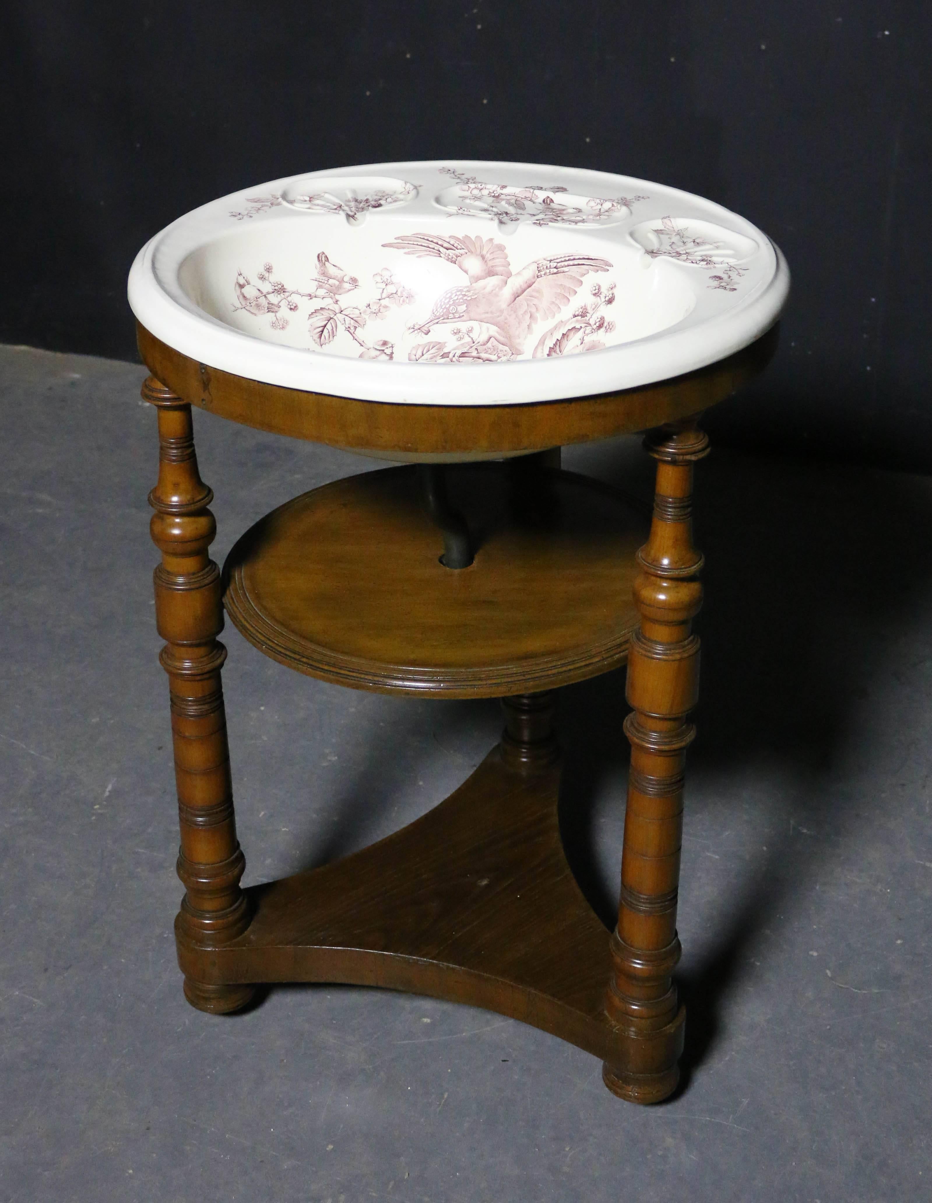 Victorian transfer printed wash basin on walnut stand.