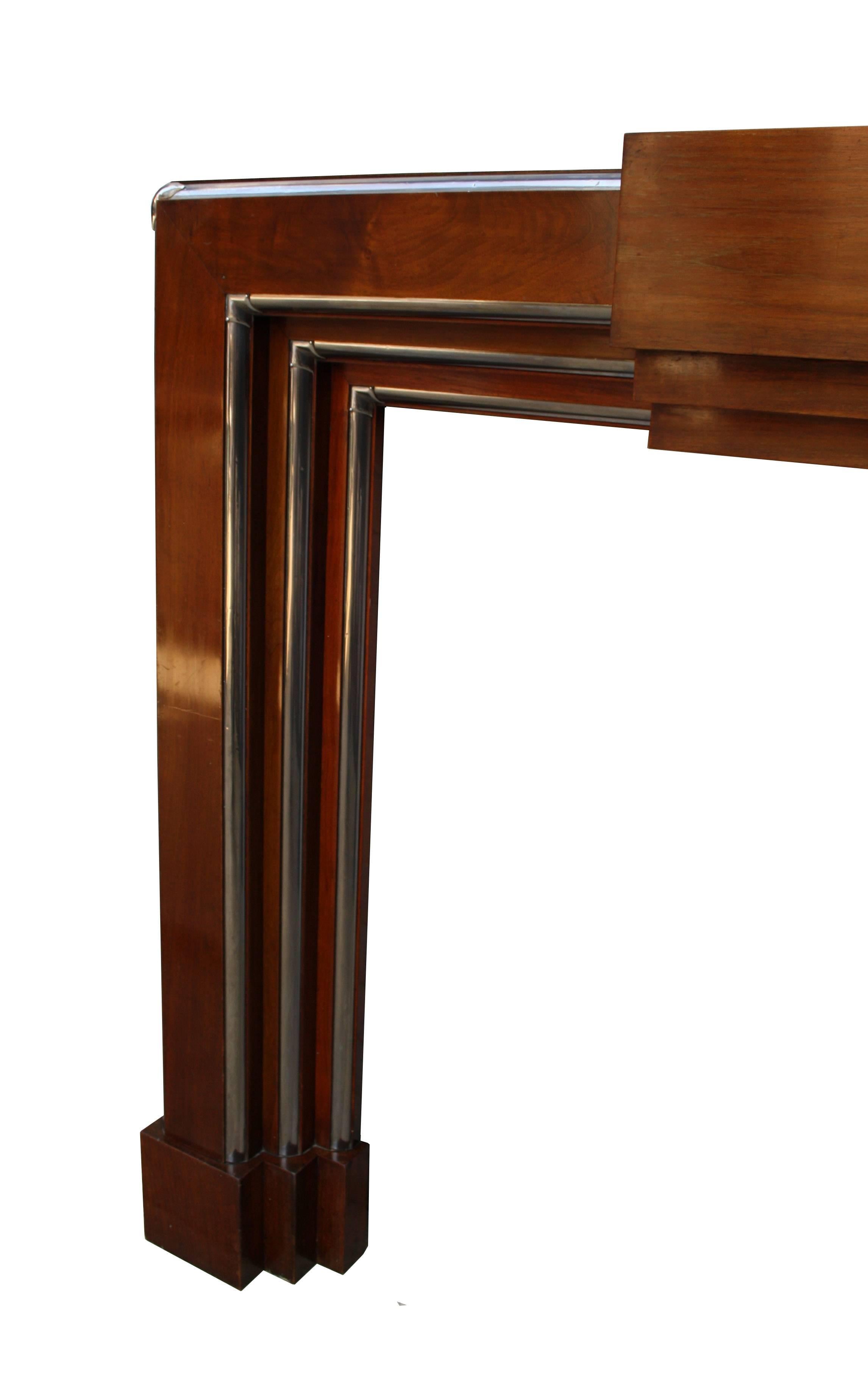 Rare Art Deco walnut and chrome fire surround, circa 1935. Opening height 100 x width 100 cm (39.5 x 39.5 inches).