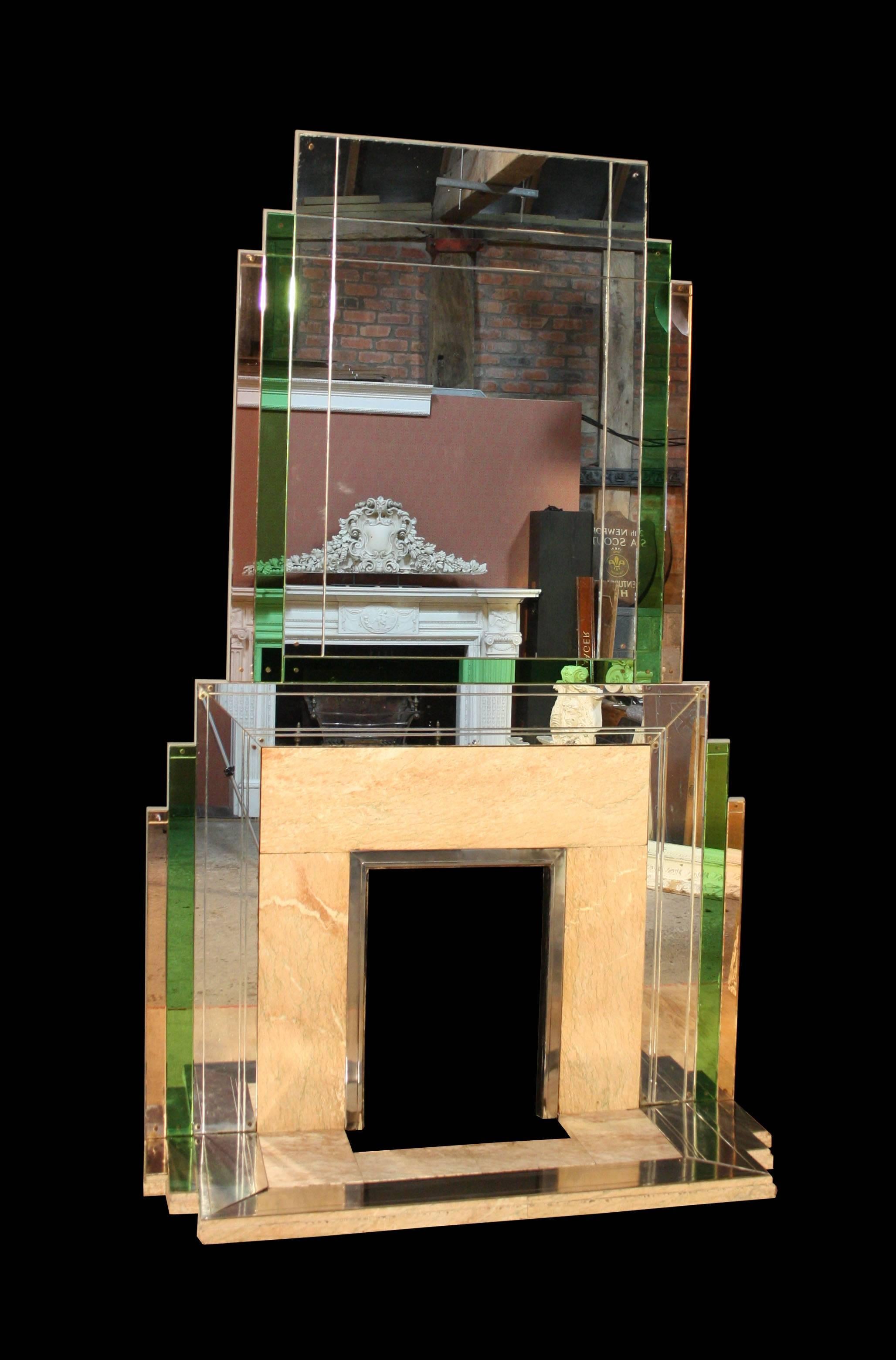 A very rare and impressive Art Deco fire surround by Bratt Colbran
Constructed from silver, peach and green tinted mirror glass attached to a timber frame. With Valance pink (Rose de Valence) marble slips and hearth. The hearth edged in stainless