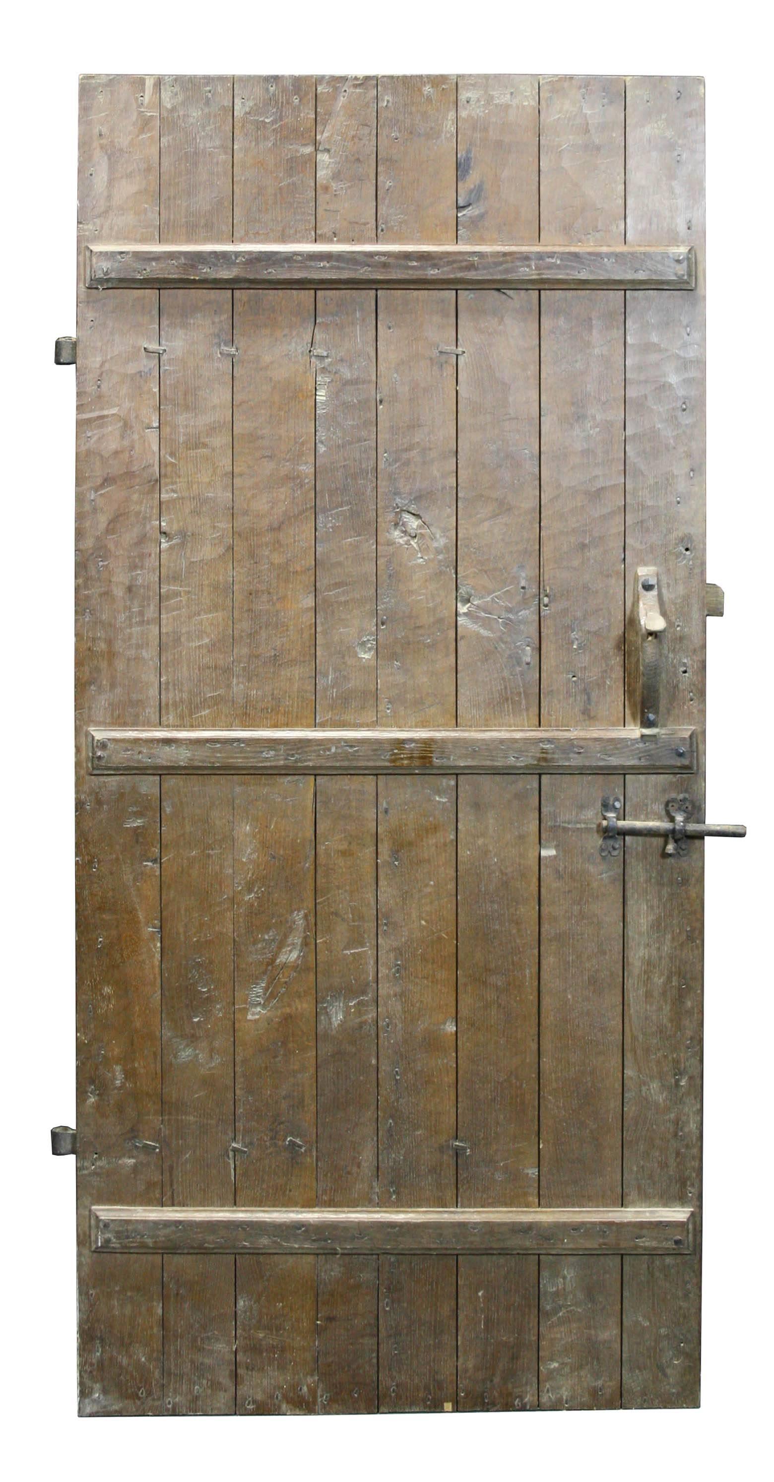 Rustic style door, handmade from oak, with iron nails.