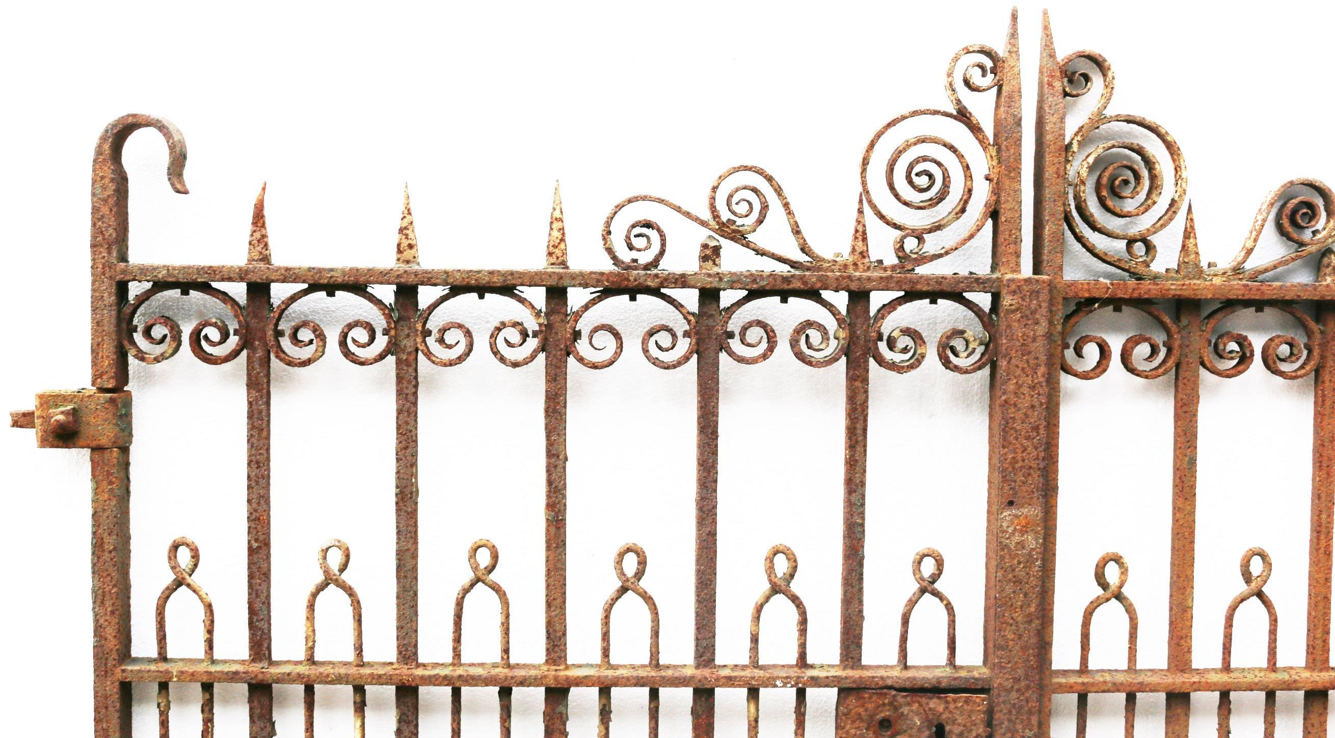 These gates are in sound condition with a rust finish. There is part of the original hinge present, however there is no latch and the lock does not work.

Width 174cm (excluding hinge).