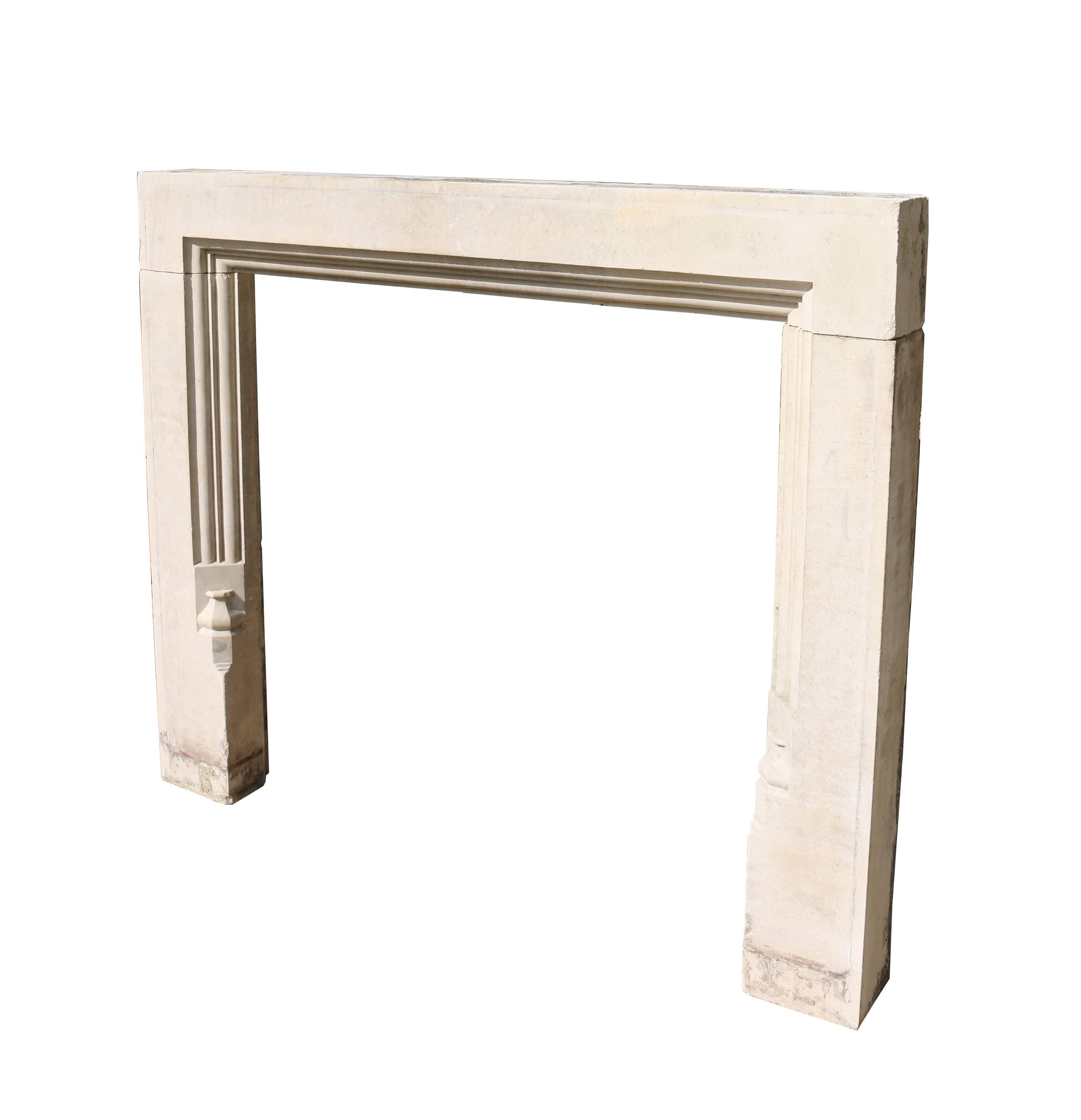 Antique Portland limestone fire surround, circa 1910. Measures: Opening height 99.5 
Opening width 102 cm.