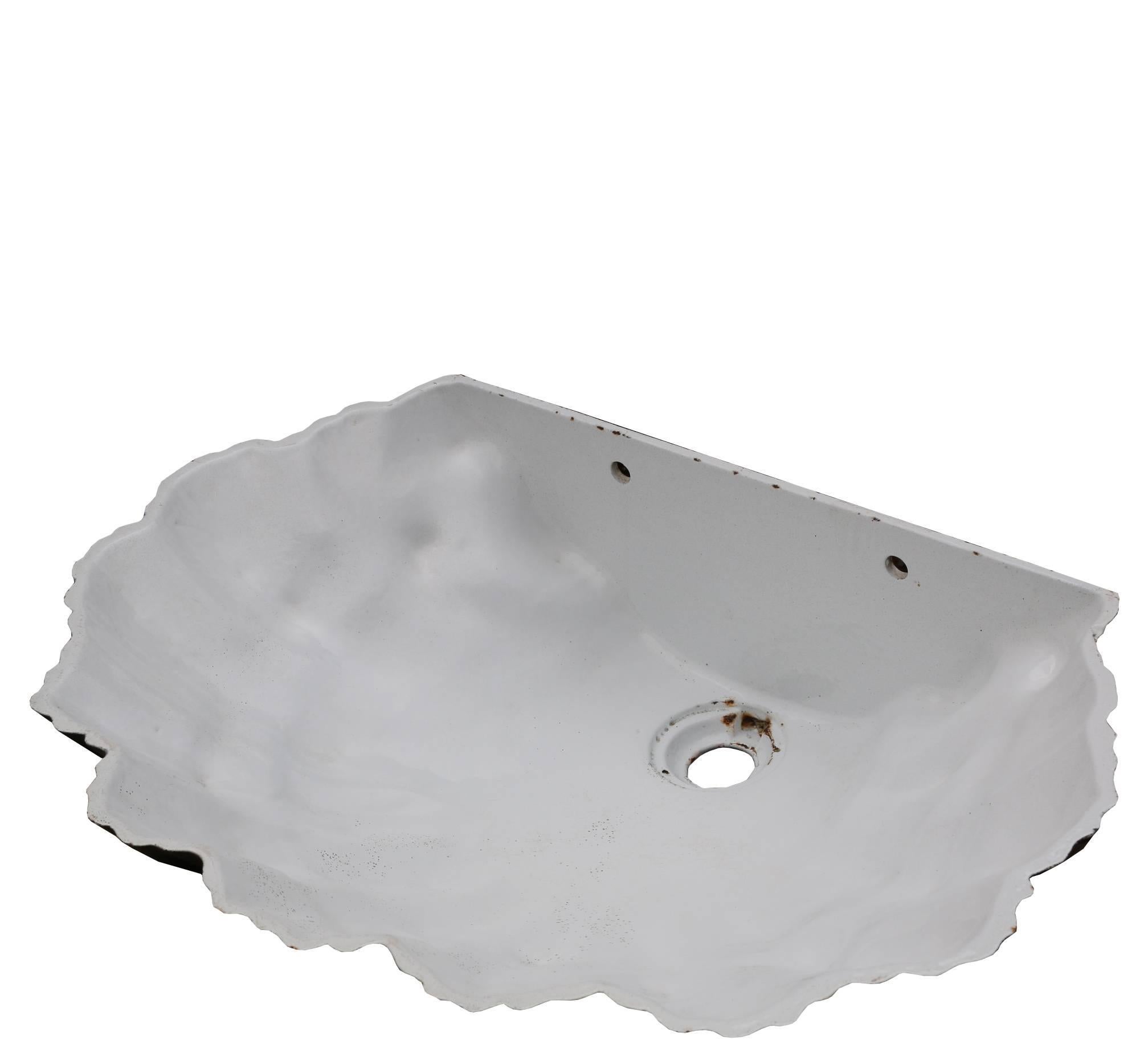 The basin is made from vitreous enamel, is white on the inside and black and red on the outside.
This sink could be used for both interior and exterior use.
This sink is wall-mounted with two holes in the back for the wall fixing.
Weight 12 kg.