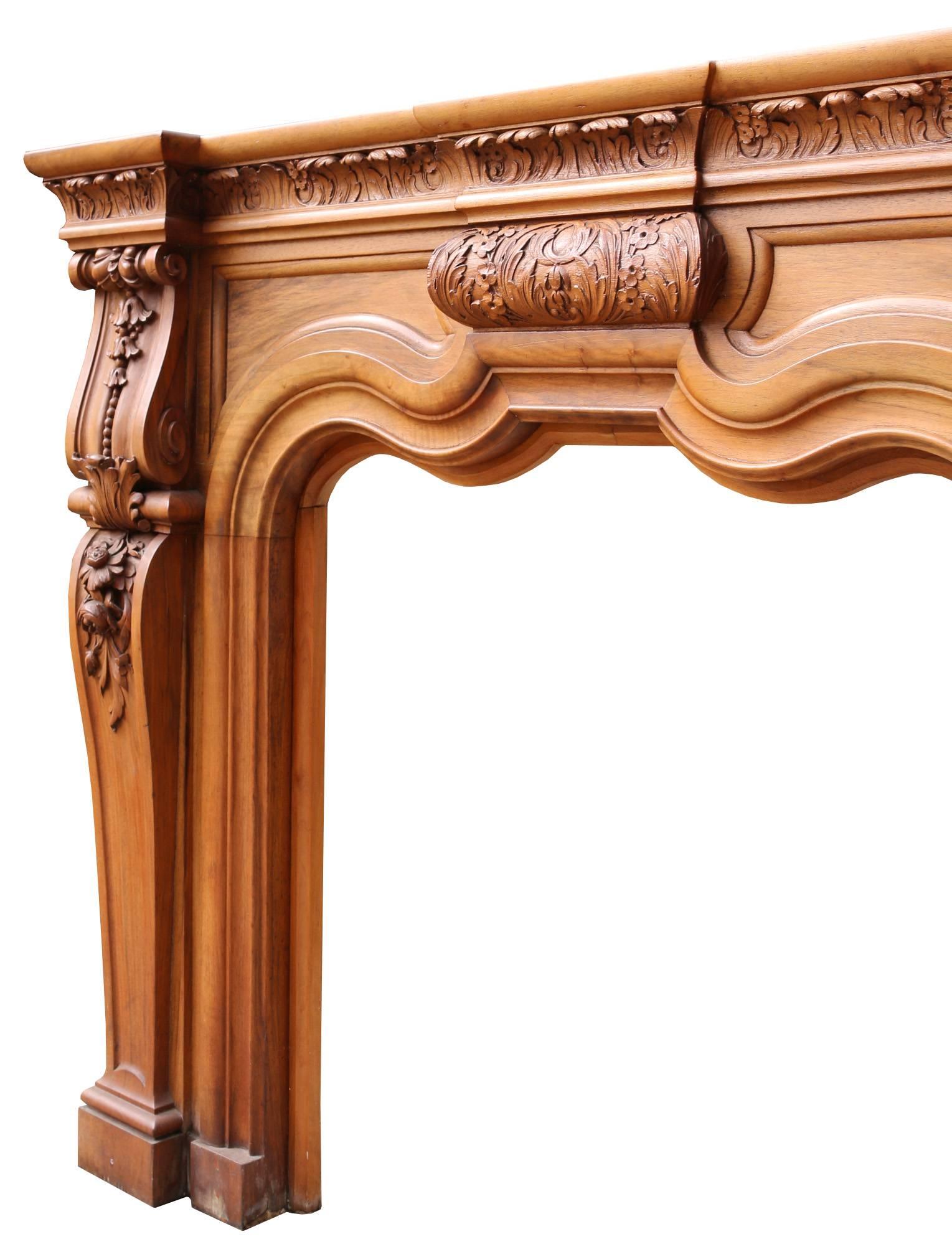 English Early 20th Century Carved Walnut Fire Surround