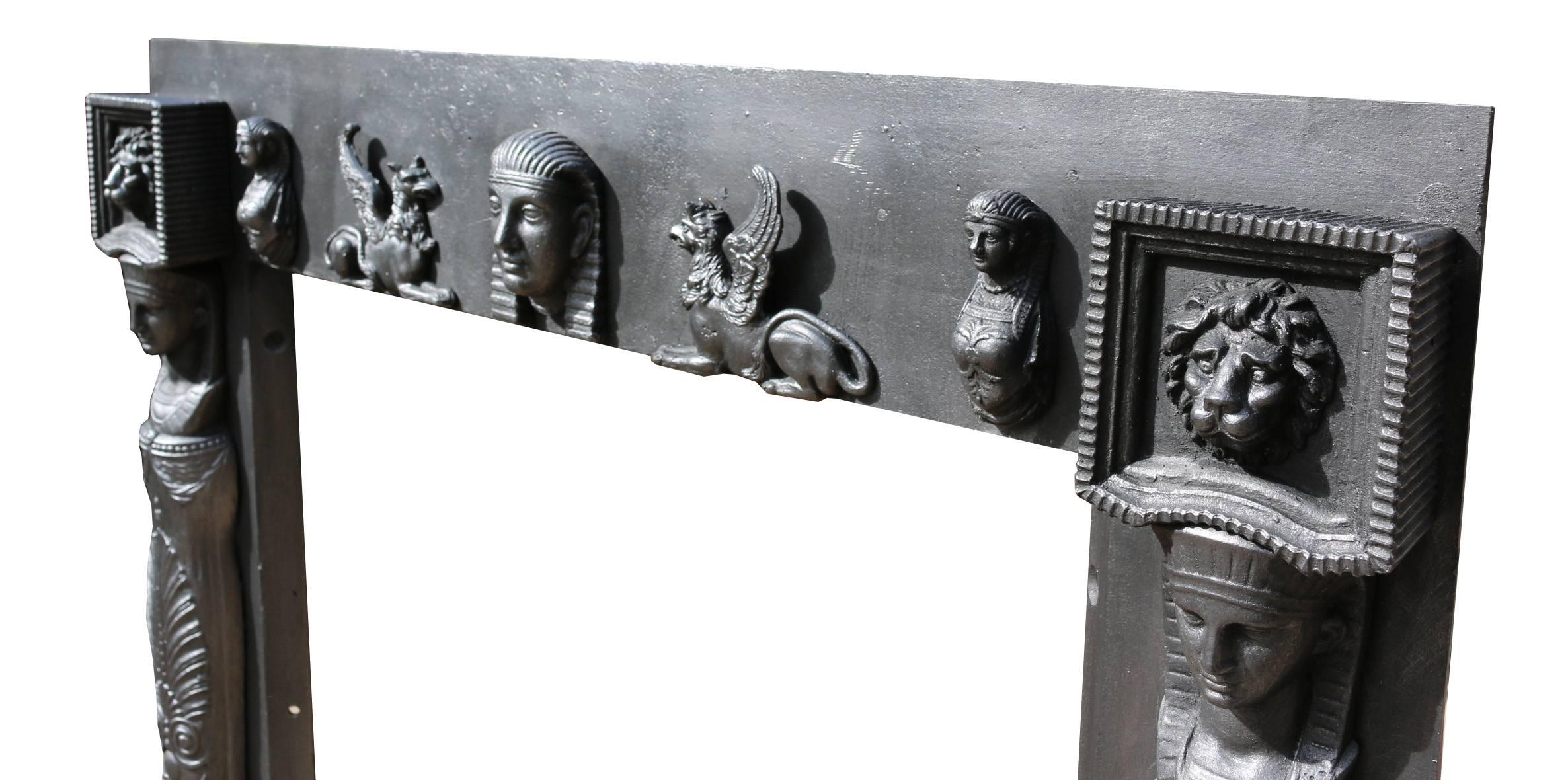 Highly decorated fire grate/front in Egyptian style, circa 1820. 
Measures: Opening height 80.5 cm, opening width 62.5 cm
Weight 50 kg.