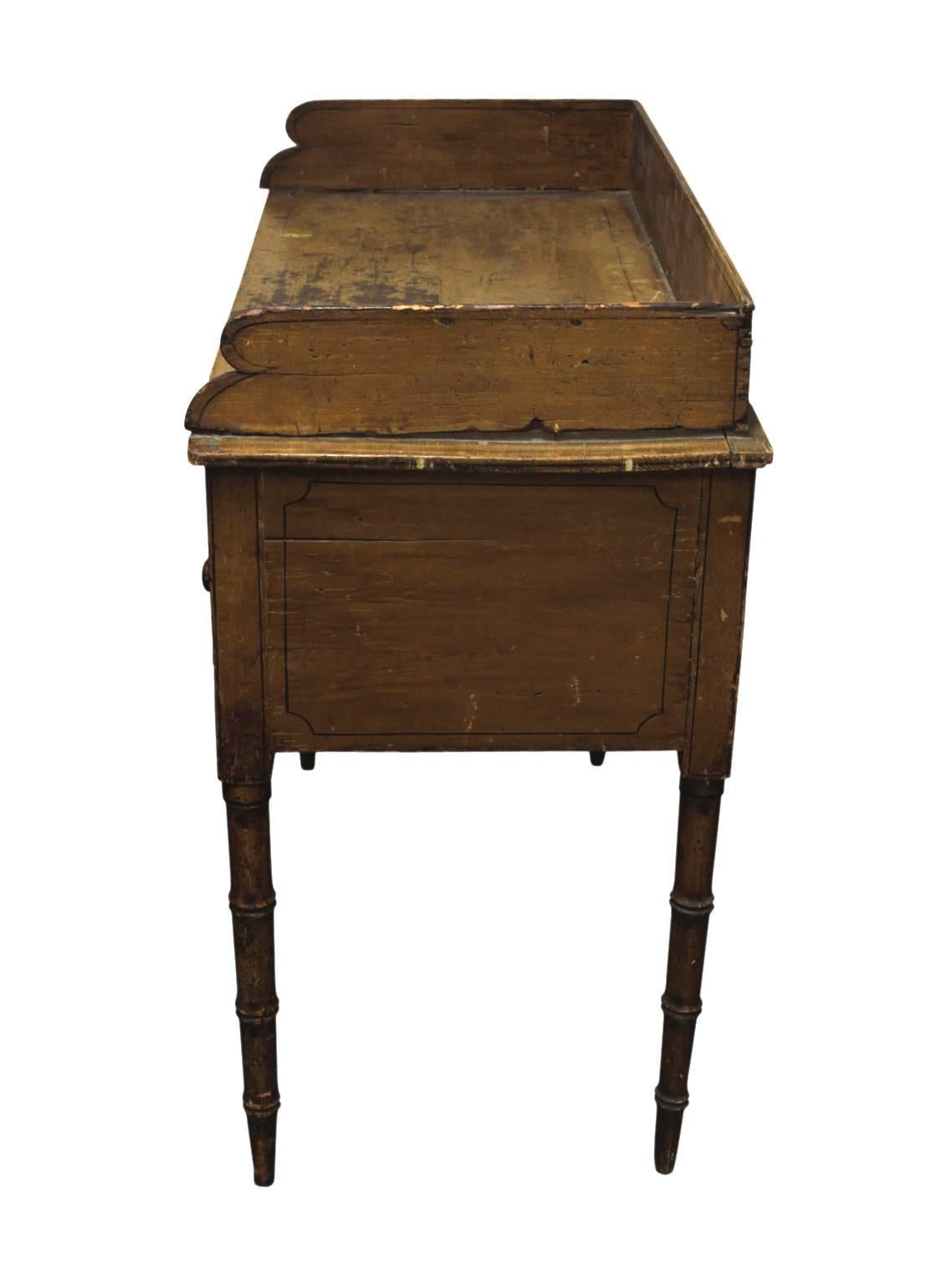 19th century writing desk or end table, with long, thin, top drawer and two large side cabinet storage spaces. Original patina, wear consistent with age and use.
