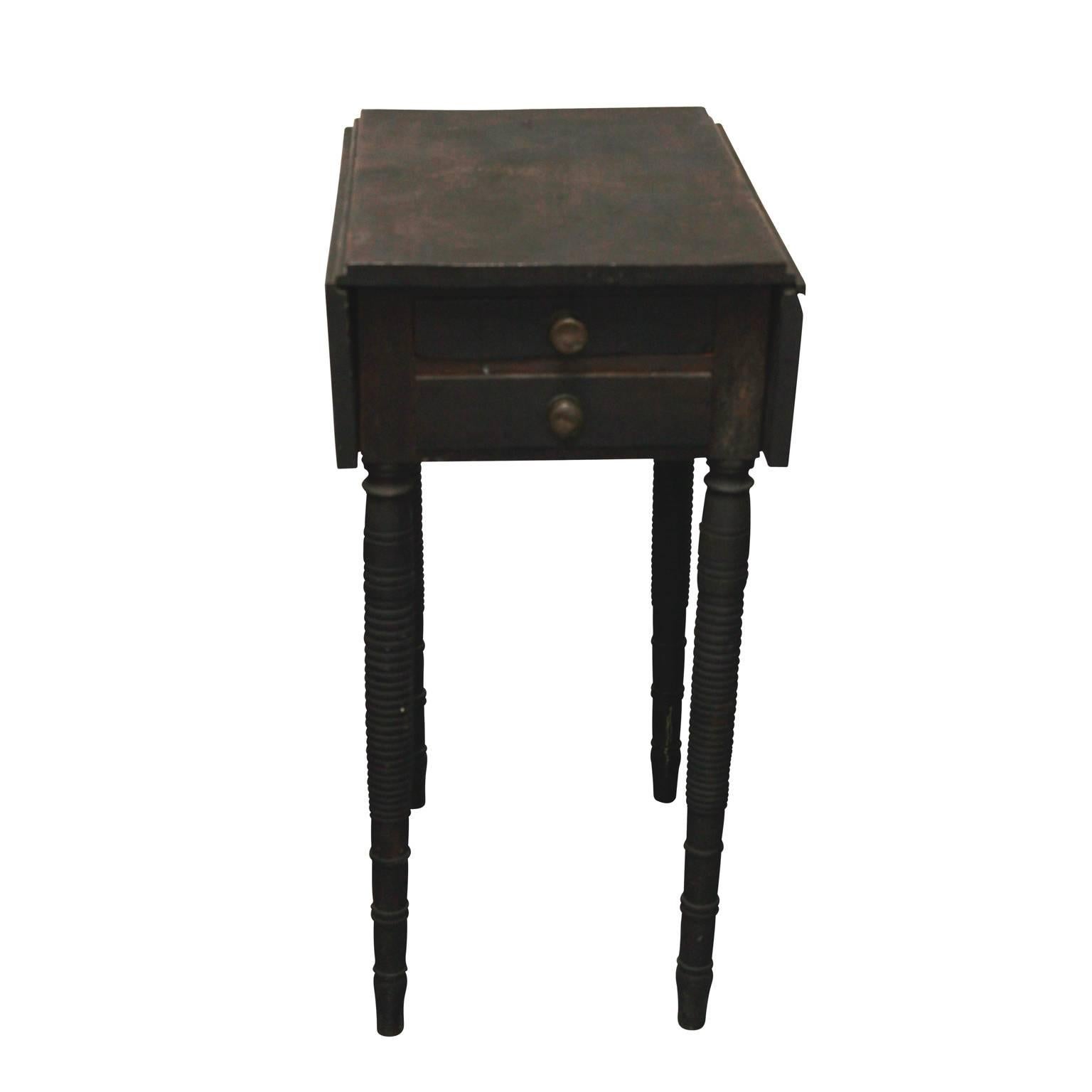 A 19th century Pembroke table, painted black, in original condition; has two drawers.