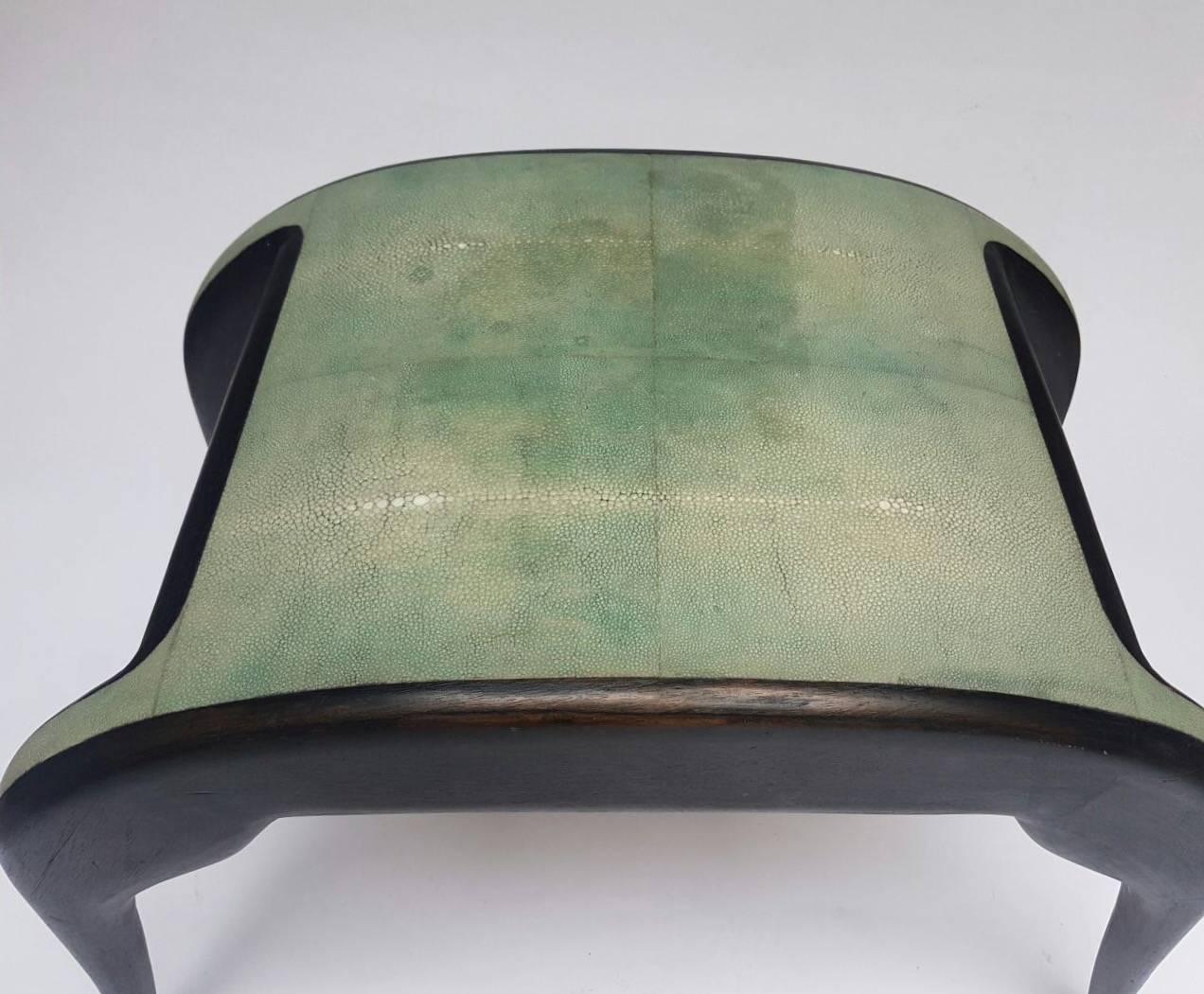 Shagreen and blackened wood's stool by Ria and Yiouri Augousti, circa 1990. Measures: Width 72 cm, height 51 cm, depth 40 cm.