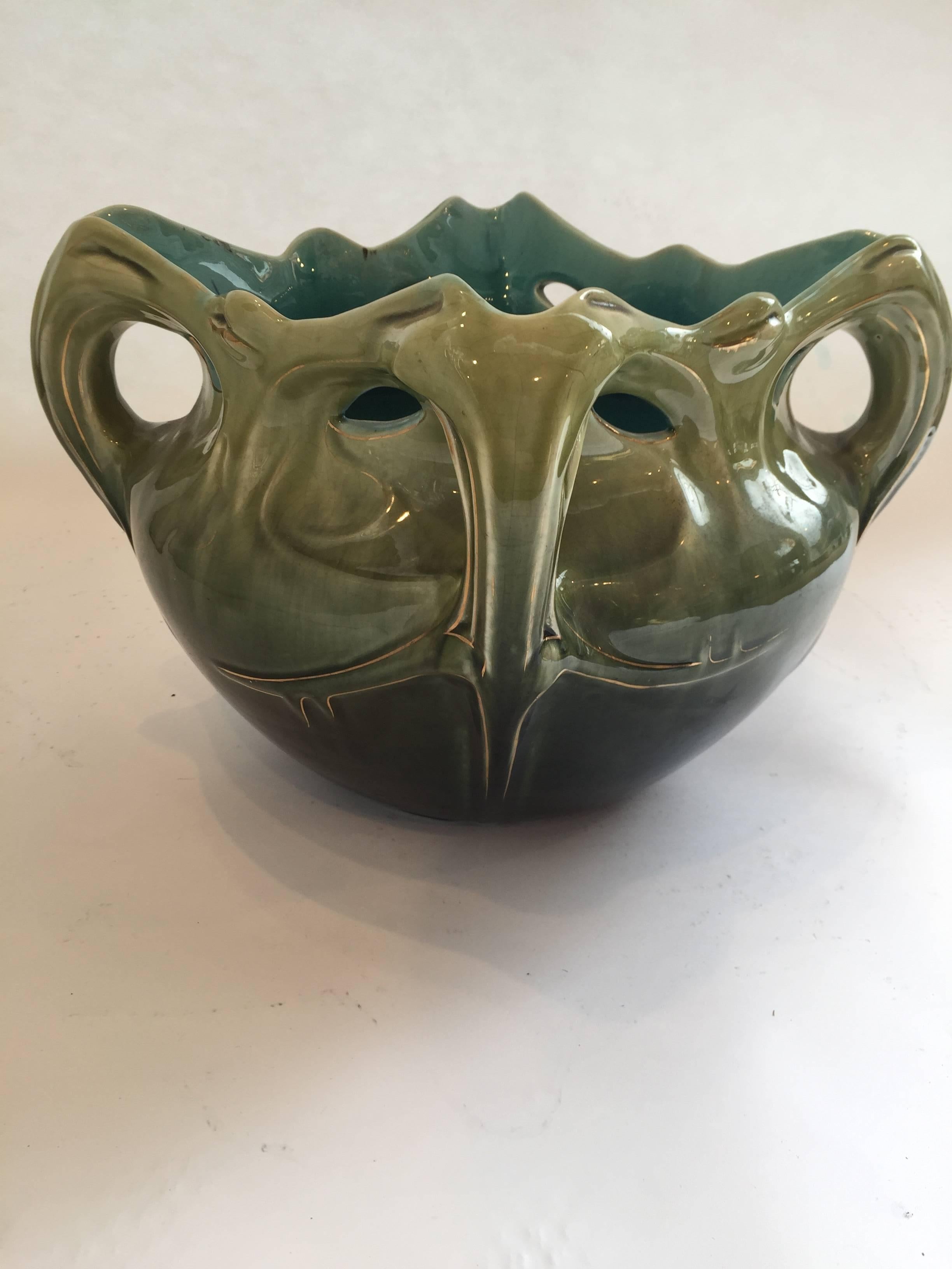 Made by Manufacture De Bruyn (Lille-France) on a draw by Hzector Guimard.
Ceramic jardiniere 