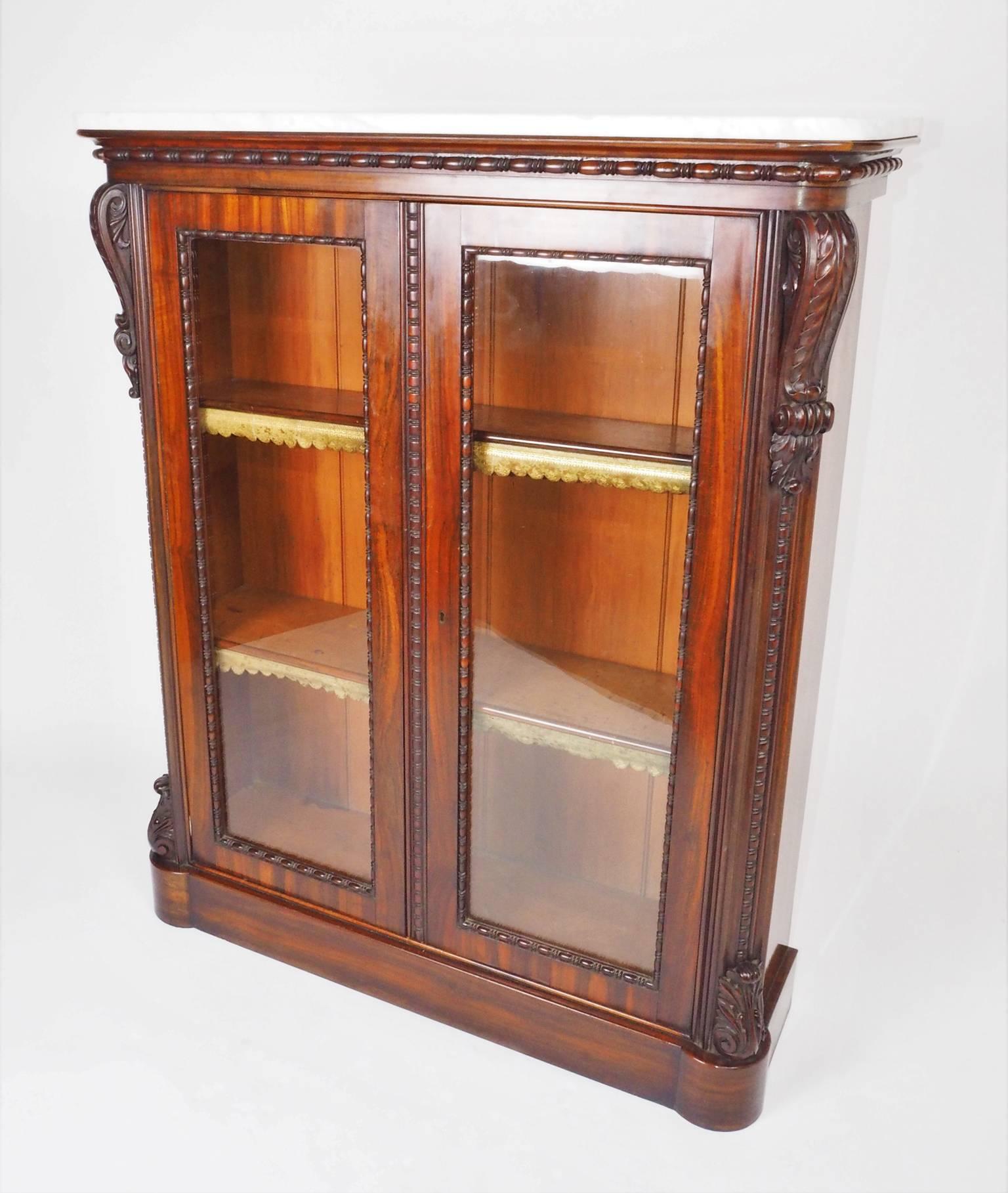 Attributed to Gillows of Lancaster and London. The elaborate beading to the
underside of the top and doors is a typical Gillows detail. Goncalo Alves, a tropical wood, was used by Gillows from July 1823 to the mid-1860s, whilst slightly cheaper in