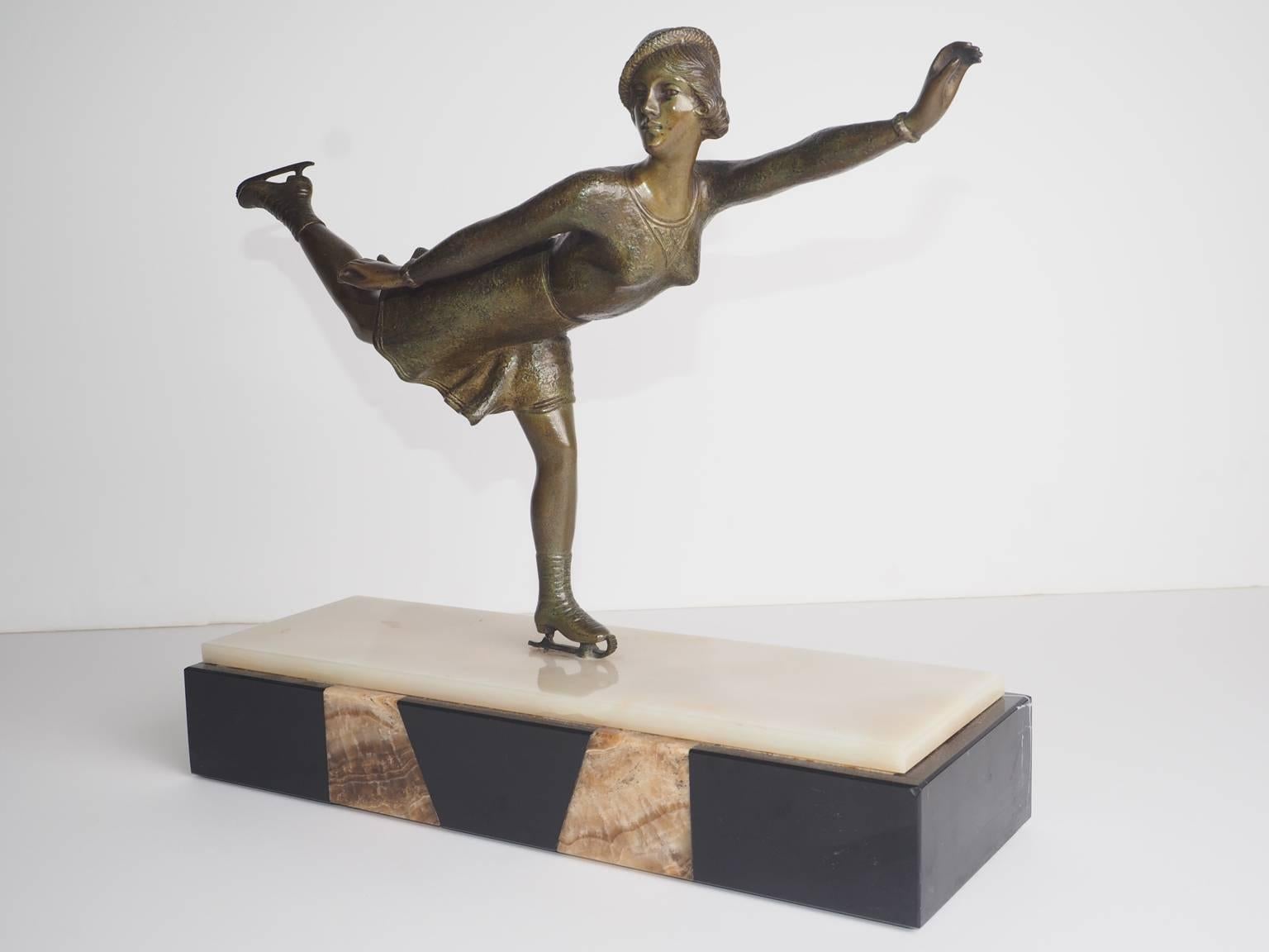 A French Art Deco period bronze figure on original marble base.
     