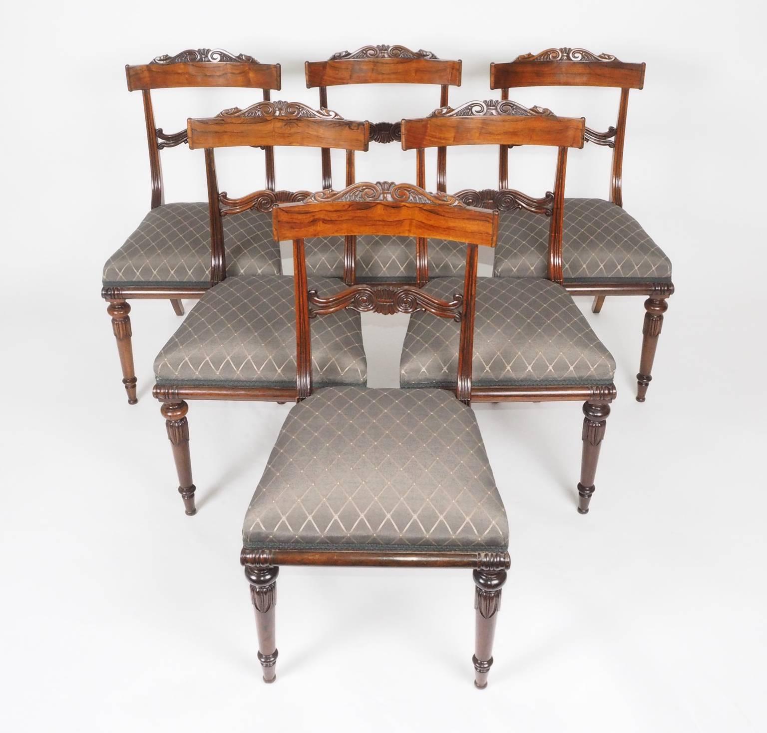 Six finely carved rosewood dining chairs, with typical crisp Gillows details and bearing two journeyman stamps 'TC'. Gillows allowed their journeyman chairmakers to stamp or sign their chairs.
 