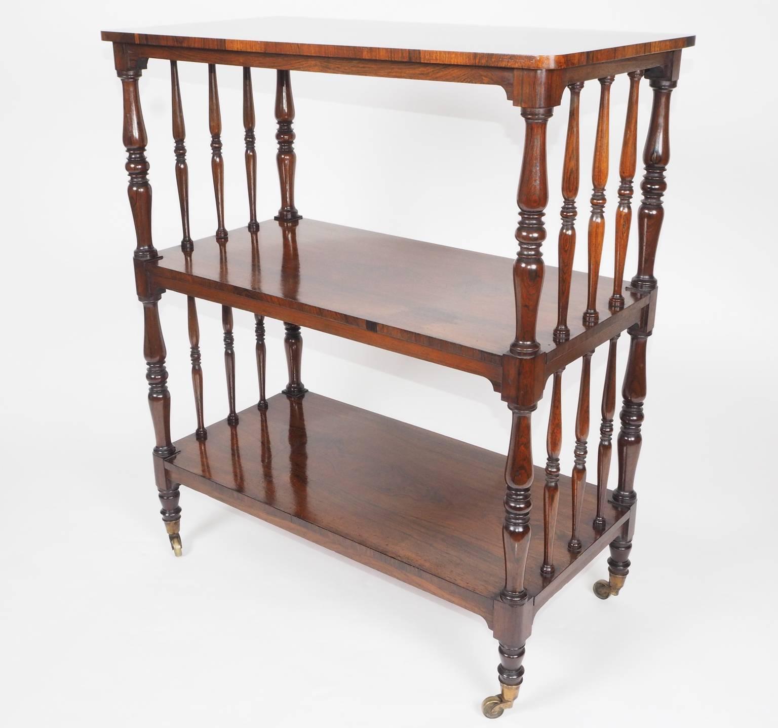 Three-tier rosewood 'étagère'/dumb waiter with typical Gillows 'spindle ends'. 
Having original brass castors.
