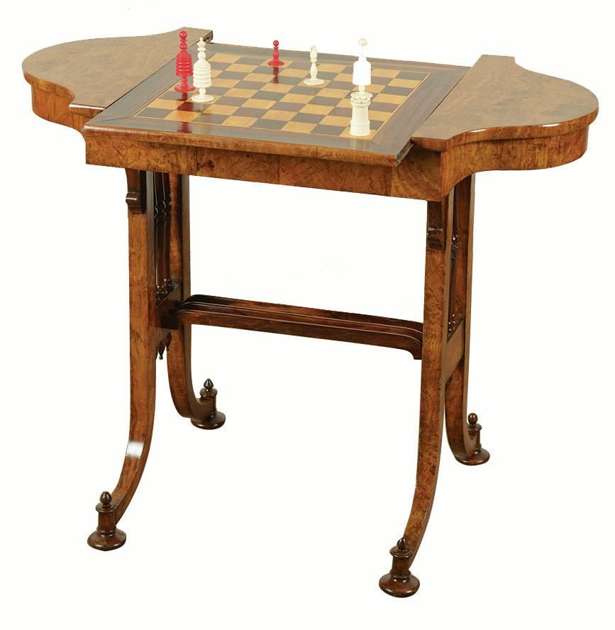 Late Regency games table with pollard oak, veneered over oak. The reversible top
has a games board veneered in Padouk and boxwood. It retains its original concealed castors
The Classic Gillows 'spindle ends' are turned in oak. See 