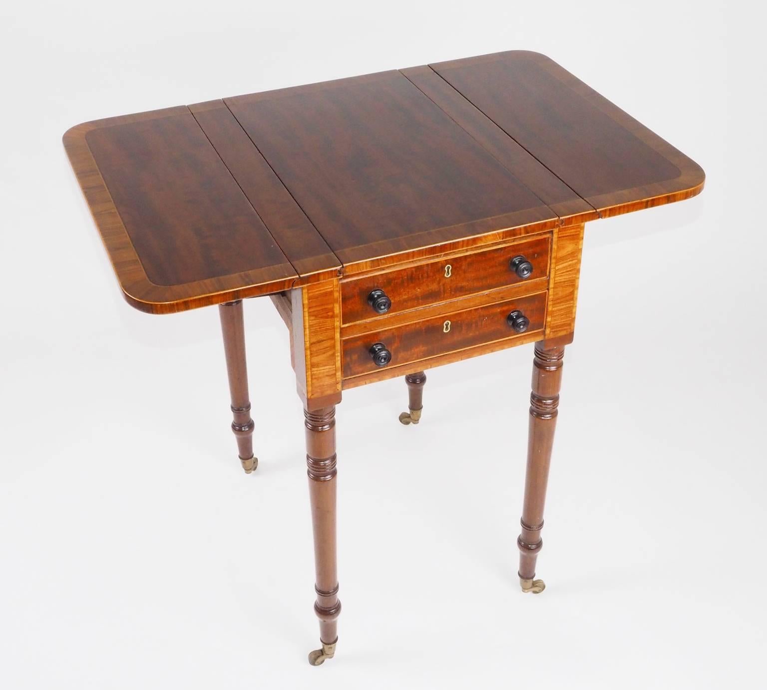 A George IV period mahogany, kingwood and satinwood inlaid pembroke games table with ebony knobs and reversible top.

Measures: H 71 x W 78 x D 51.5 (Up) W 42.5cm (Down).