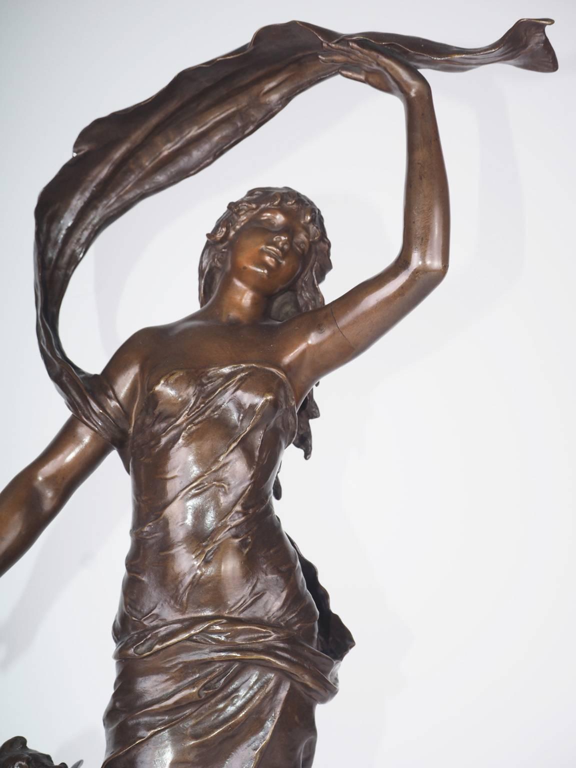 Art Nouveau bronze figure of a young woman and cherub emblematic of twilight.