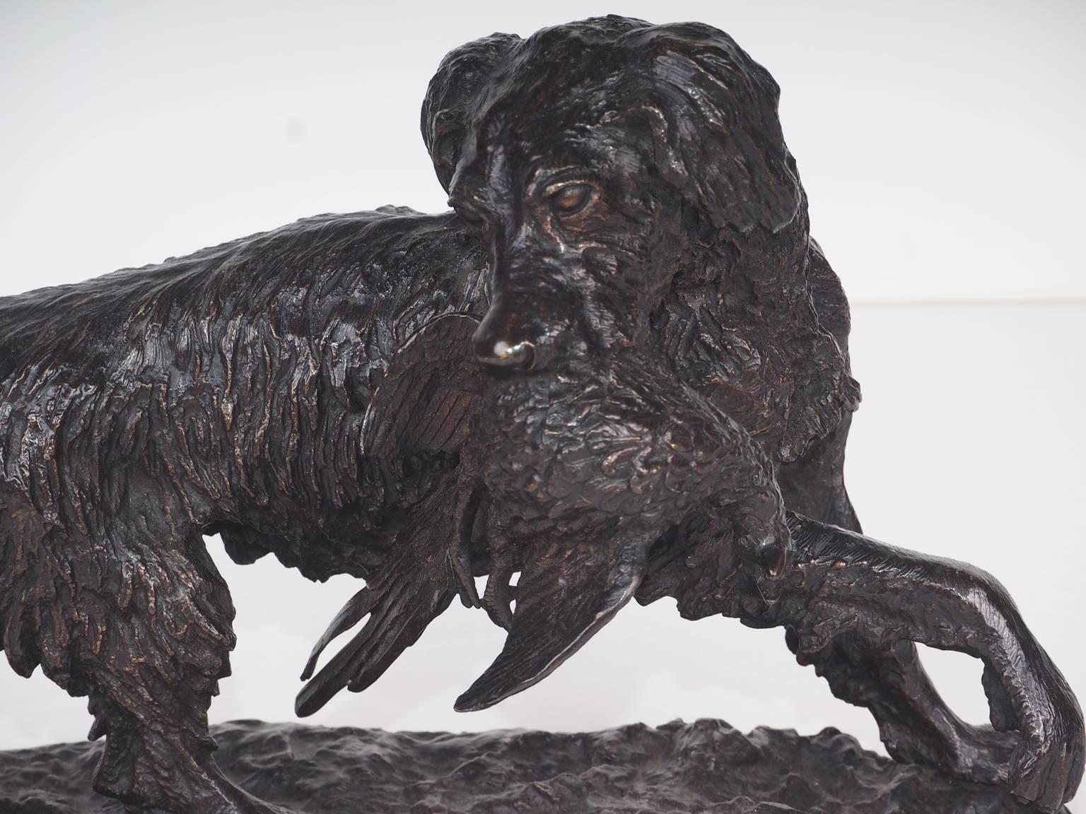 Finely patinated French bronze by Christophe Fratin depicting a retriever with newly caught game.