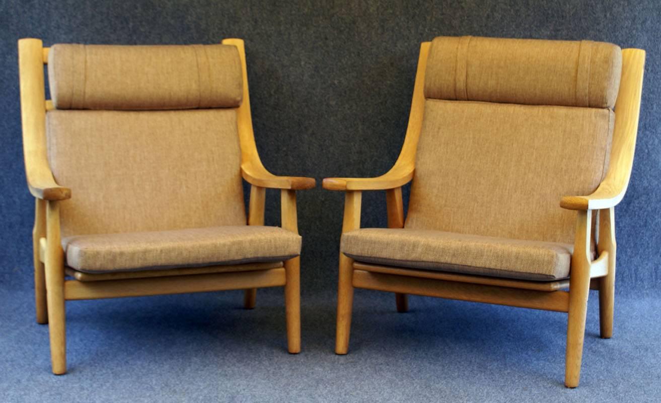 Great pair of lounge chairs and stools of generous proportions, and super comfortable, all in very good condition, with clean new upholstery.