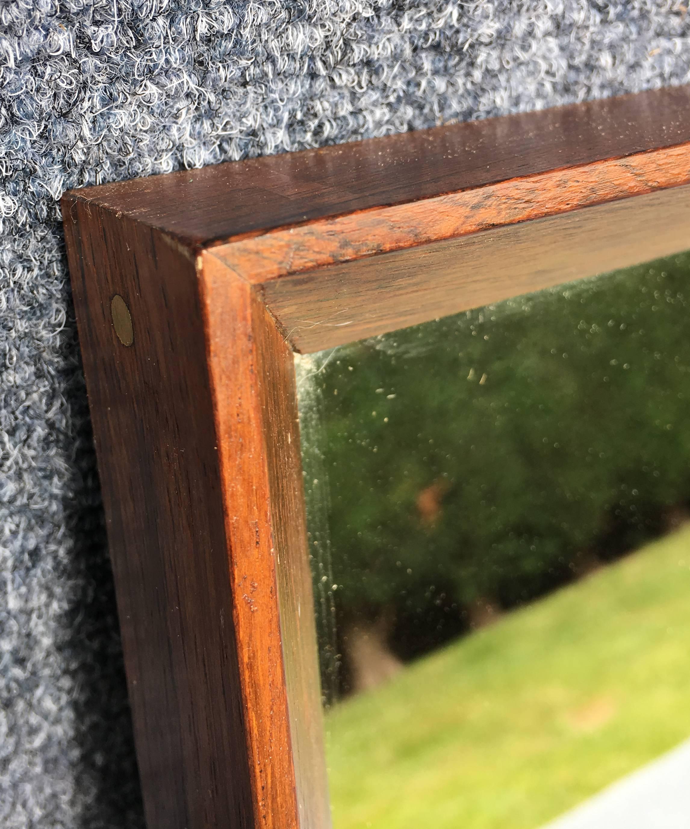 Danish rectangular solid rosewood wall mirror in very nice condition, with original plate glass mirror.