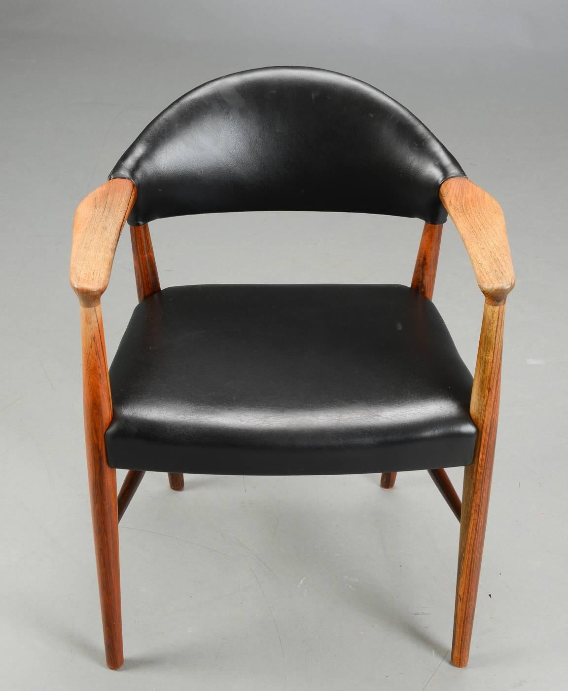 A fine quality Danish rosewood and black leather armchair by Kurt Olsen, ideal as cool Mid-Century occasional chair or a very nice chair to sit at a rosewood desk.