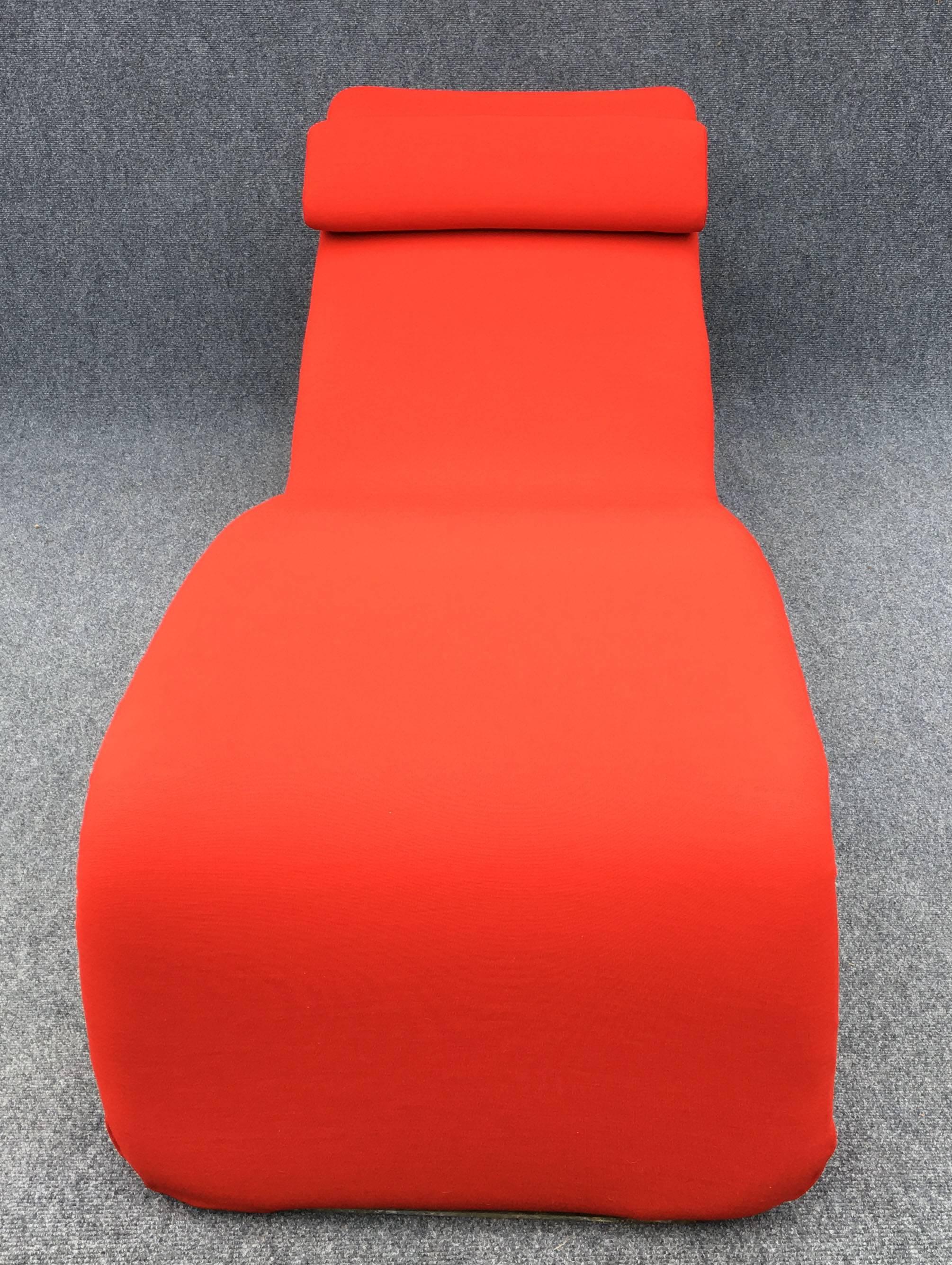 An totally recovered Djinn chaise and original frame, covered red stretch Jersey.