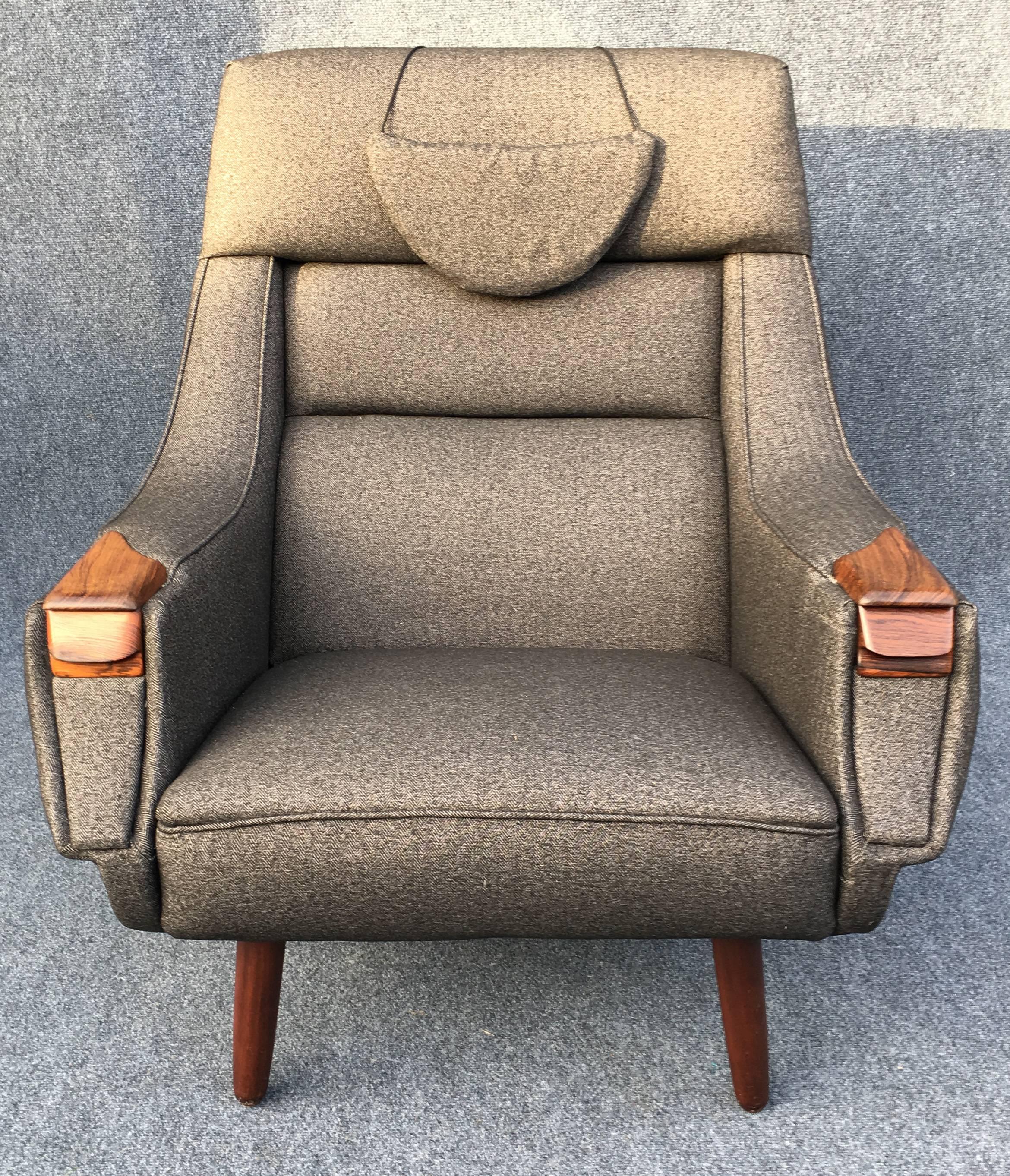 Beautiful rosewood armchair from H.W. Klein, freshly upholstered in high quality fabric, the right arm with a small drawer!