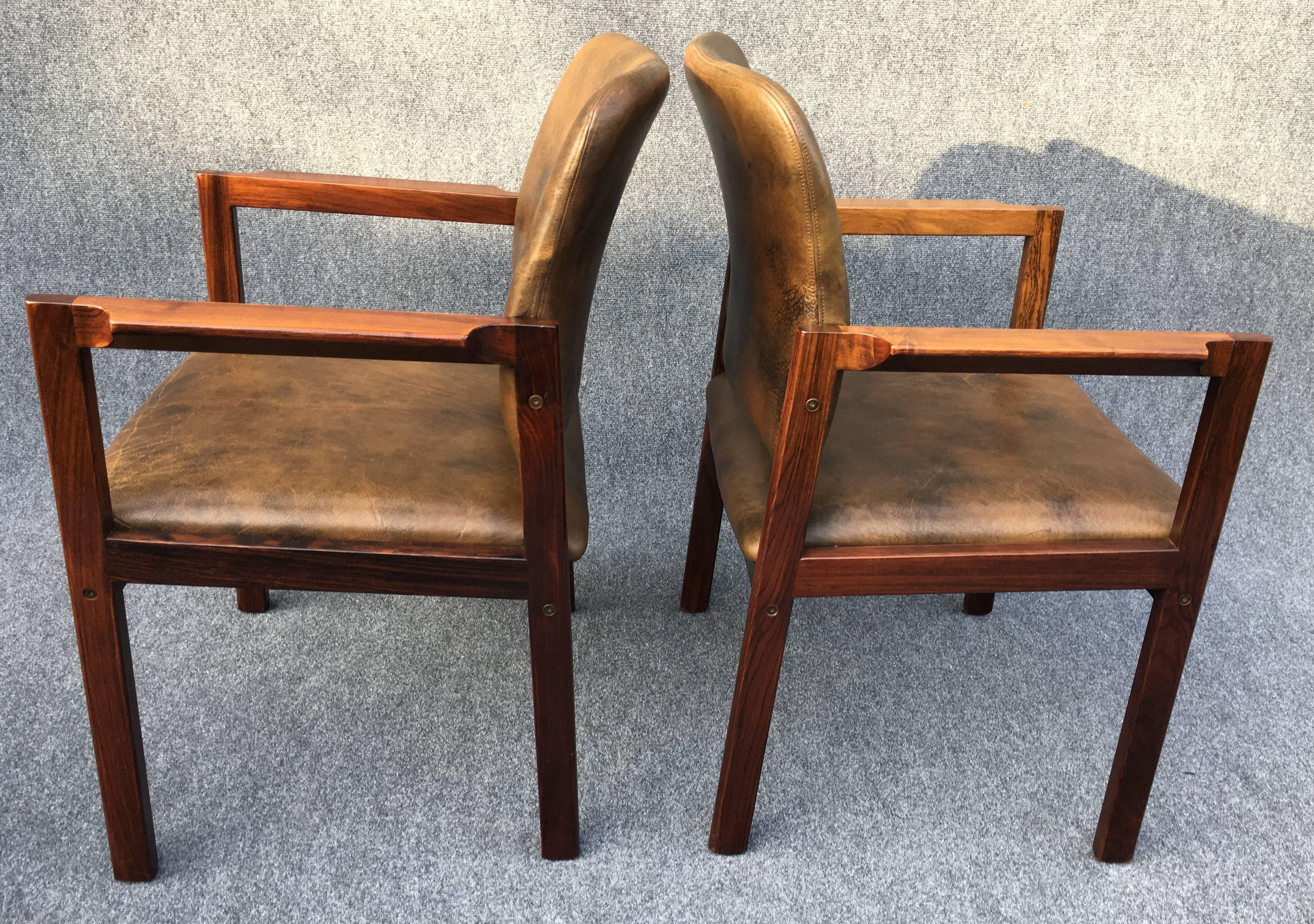 Nice pair of original Mid-Century Danish armchairs by Bjerringbro of Denmark in good condition with original leather upholstery.