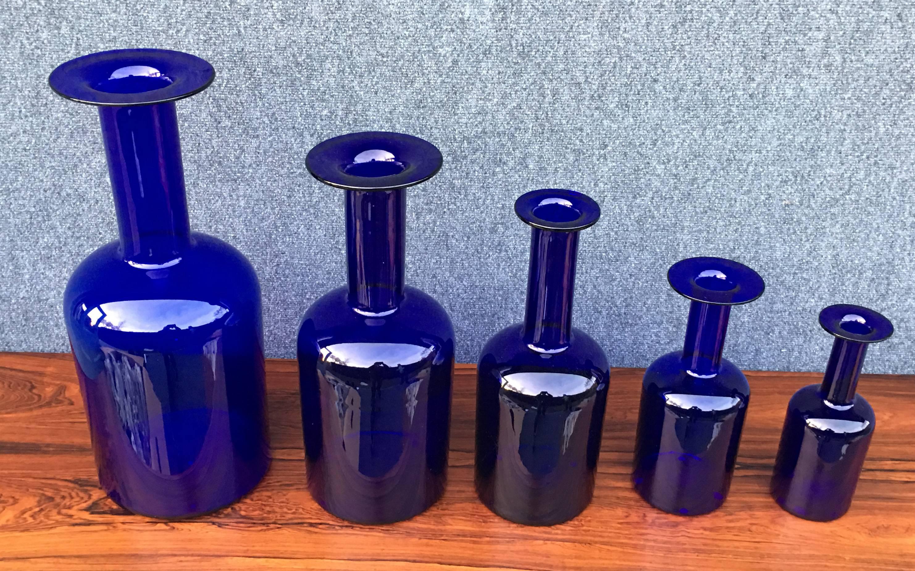 A perfect and original set of five graduated 'Gulvase' by Otto Brauer for Holmegaard in blue. Price is for the whole set.

The sizes from large to small are:
50 cm high x 20 cm diameter,
43 cm high x 17cm diameter,
38 cm high x 14.5 cm