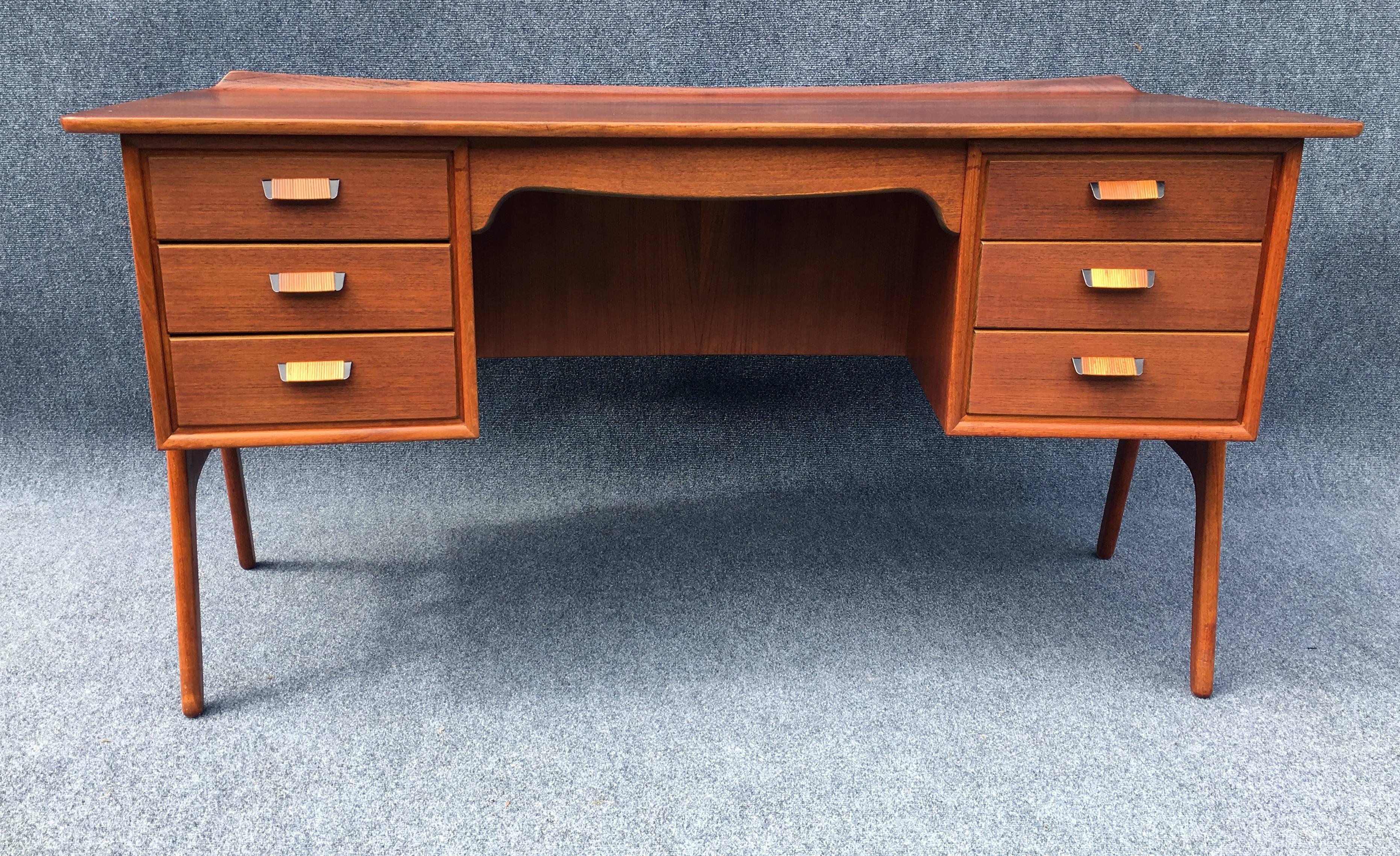 Stunning and very rare first edition desk in excellent original condition, all wicker wrapping on legs and handles in tact, and ready for any cool Mid-Century home or office.