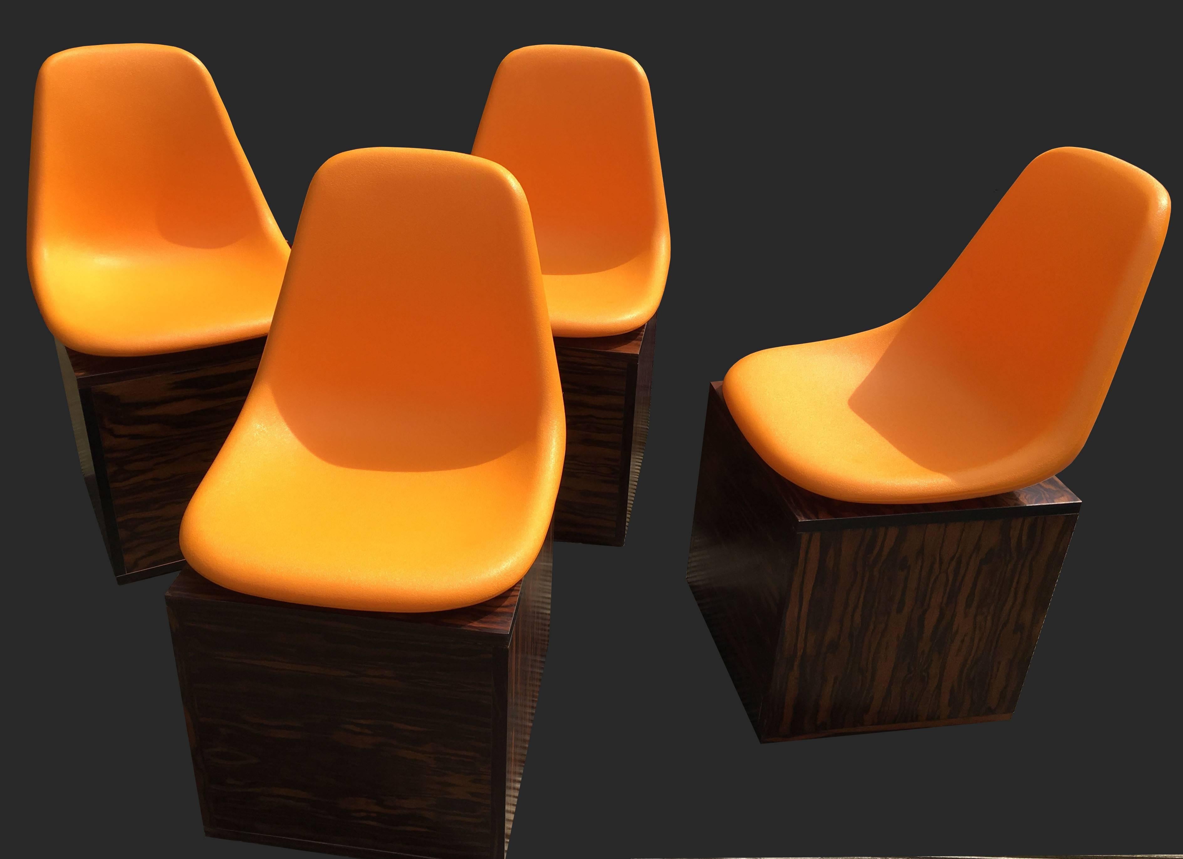 Cool Mid-Century dining chairs of unusual design, the top in bright orange textured polypropylene. And the cube bases in exotic hardwood, all in great condition.