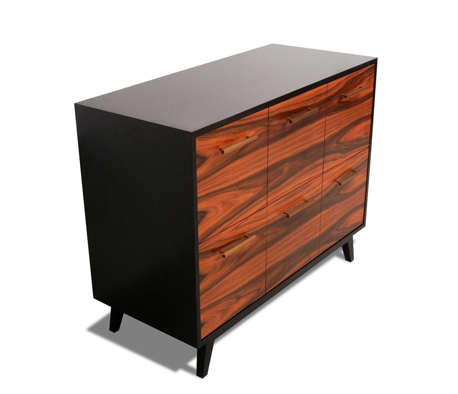 The Atocha Design Record cabinet is a handcrafted furniture piece that gives you quick access to your music collection—and elegant storage when it's not in use.

The featured piece uses santos palisander hardwood veneer, a sustainable species