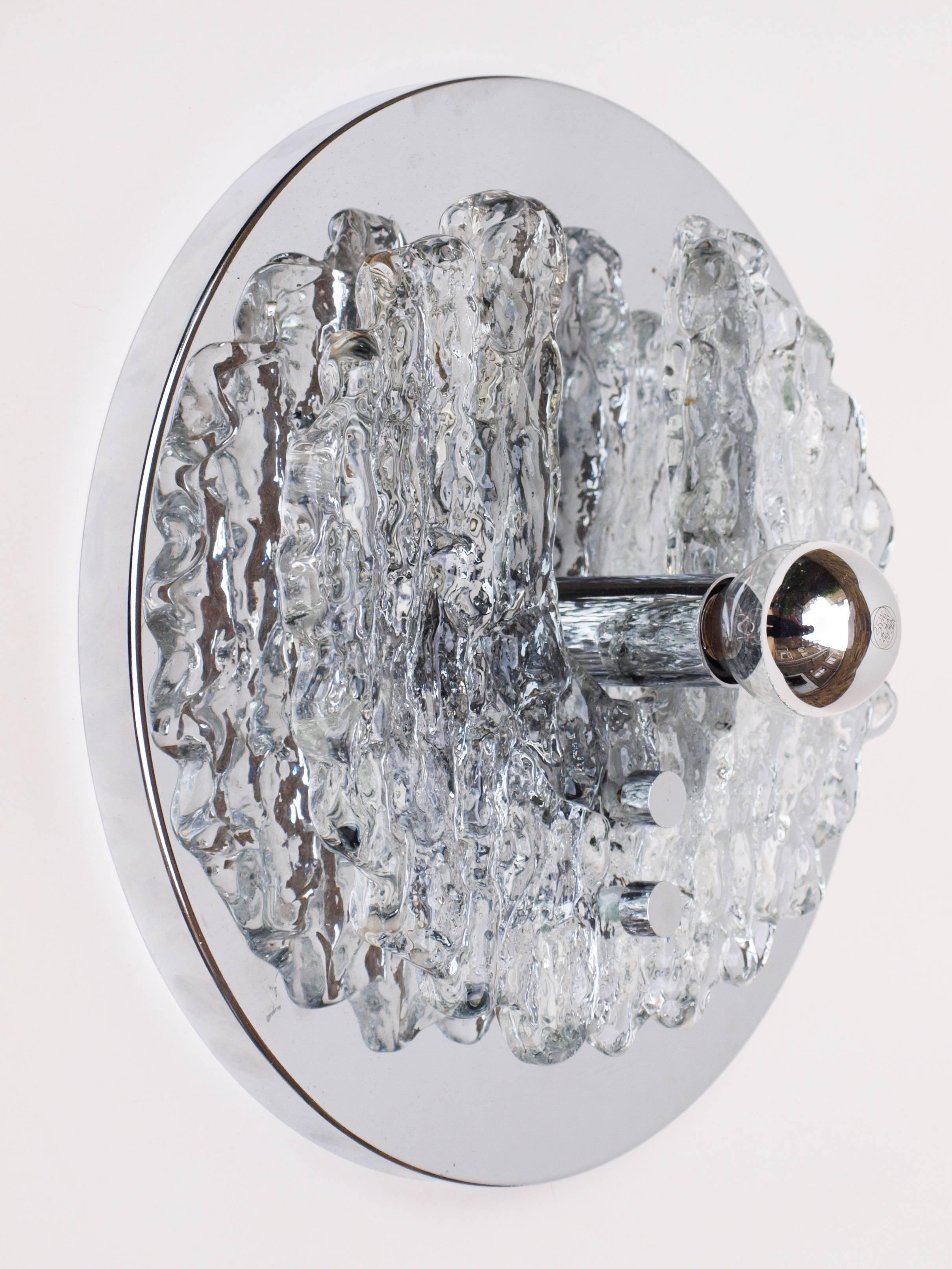 These stunning Murano Fabbian wall lights unite an irregular icicle-like hunk of Murano glass with a smooth disk of chrome-plated steel. The pair would sit beautifully in a hallway, living room or either side of a bed.

 