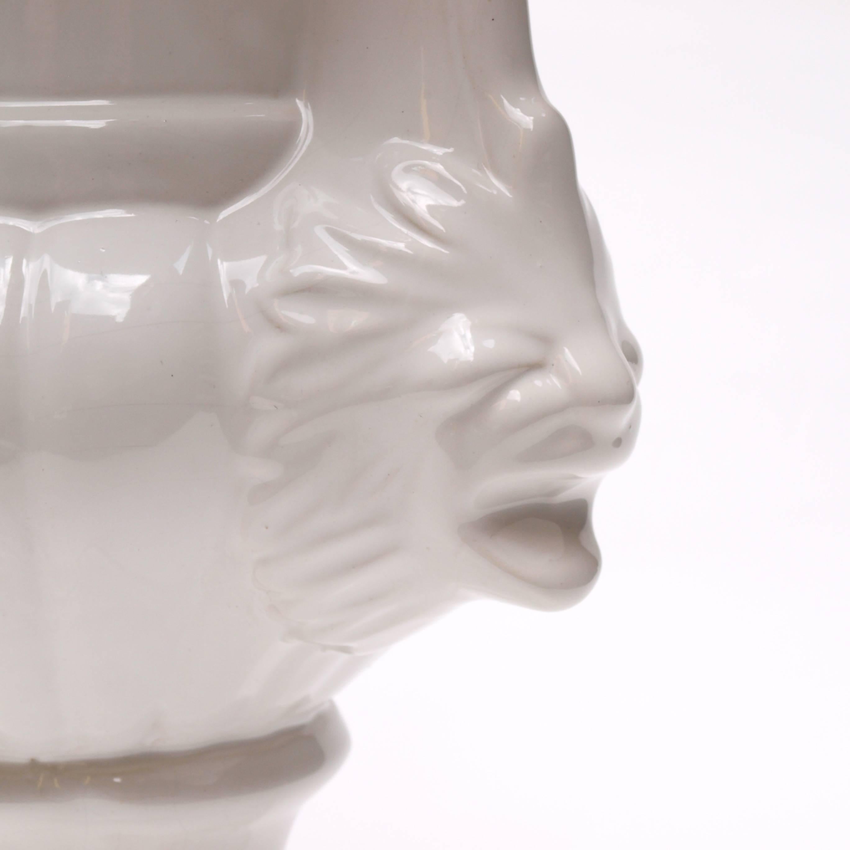 white ceramic urn