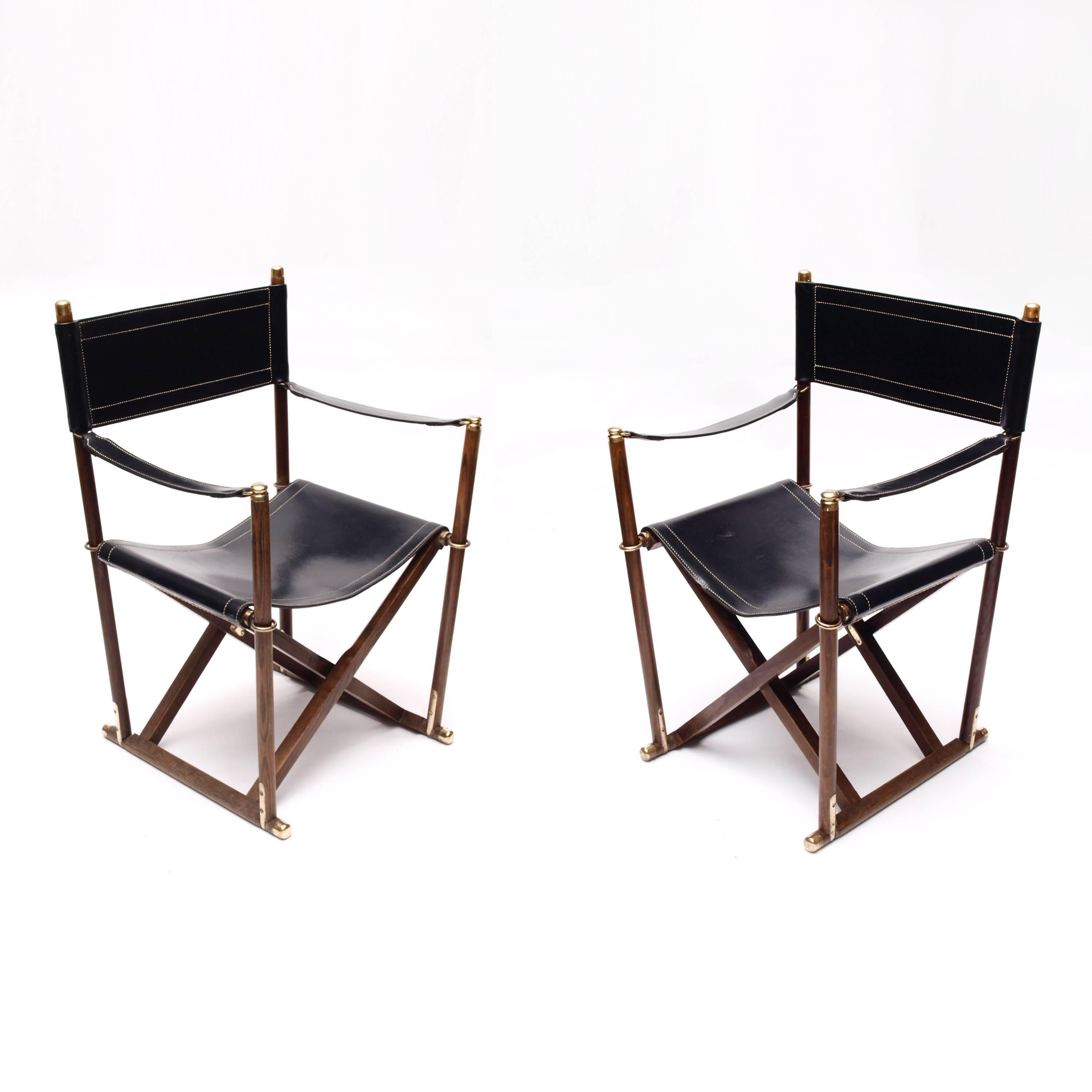 An important pair of handmade Mogens Koch folding Campaign chairs. Originally designed in 1932 as temporary church seating, this pair of scarce and historically important chairs date from the 1930s, and were only available as made-to-order at this