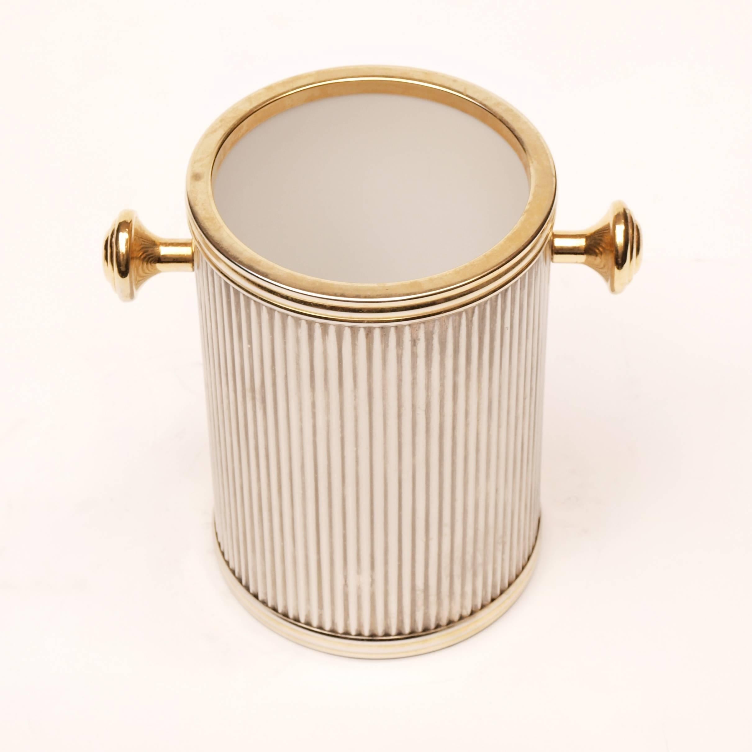 A glorious Ice bucket and wine cooler set finished in ribbed silver with gold trim and a fabulous mirrored lid.