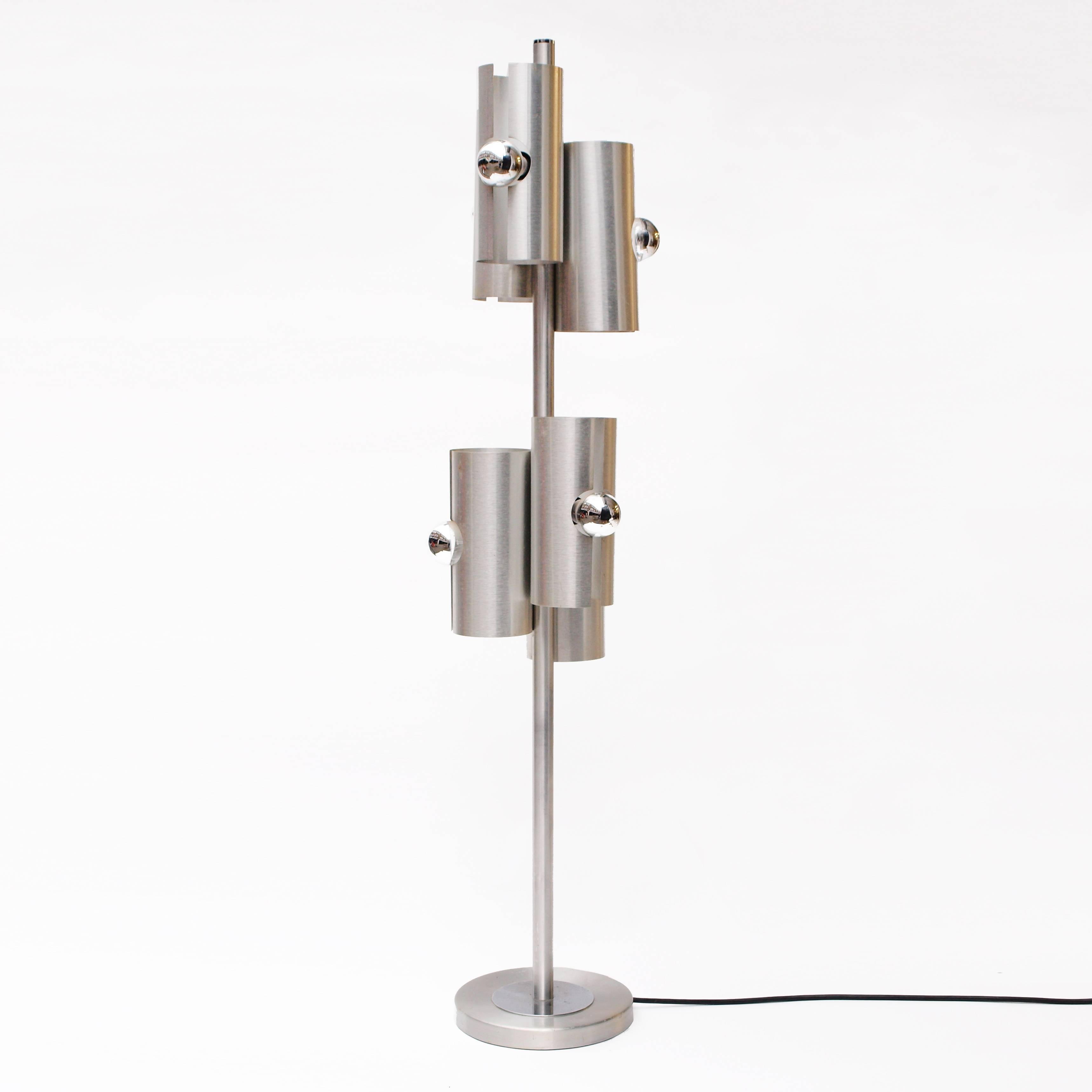A 1970s modernist brushed aluminium floor lamp, by Max Sauze with six bulbs and three settings of either both, top, or bottom lights on.