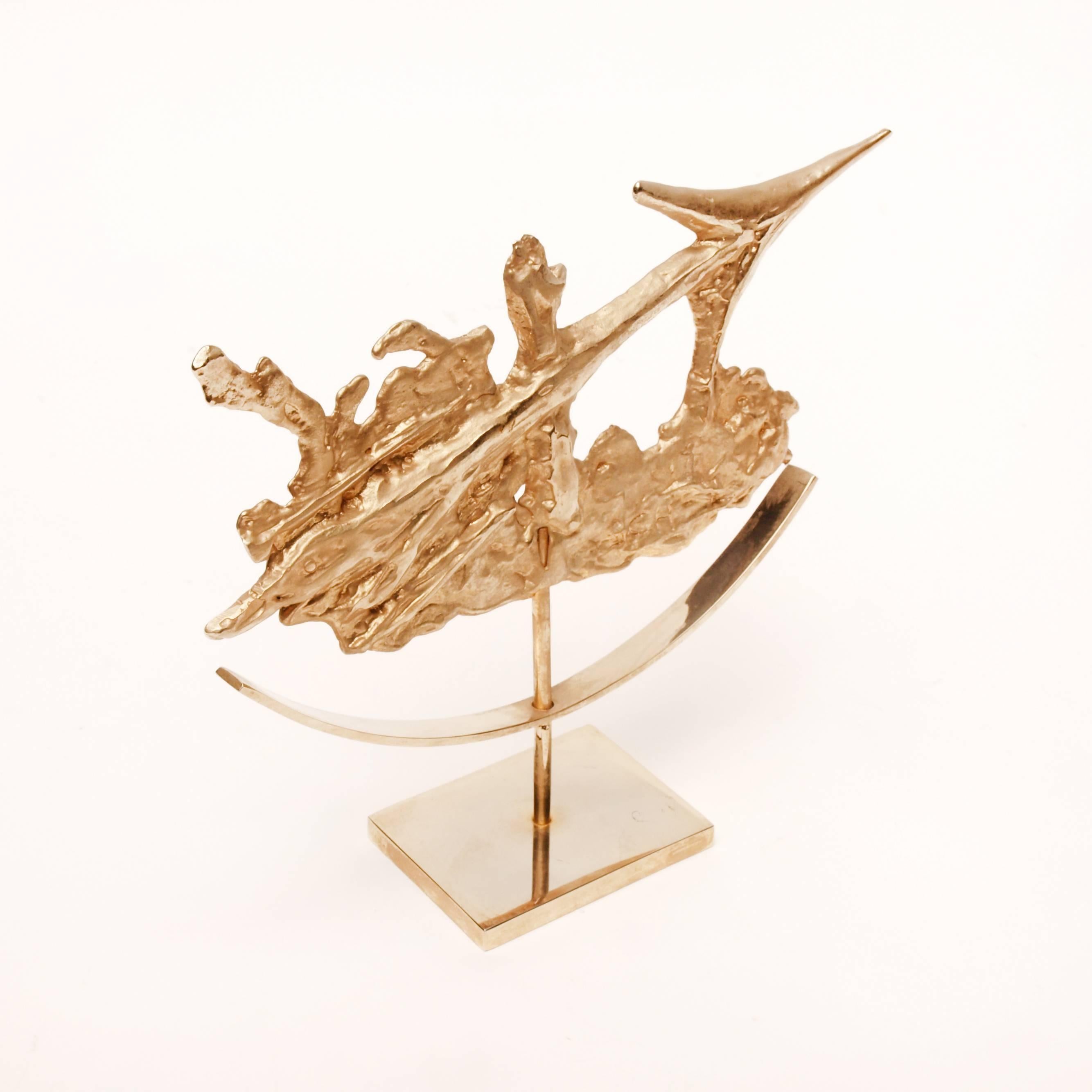 A gilded Sagittarius zodiac sculpture by Philippe Cheverny. The French designer is known for his ornamental pieces, sculptural lamps and furniture designed and manufactured throughout the 1950s-1970s. His works have since become sought after for